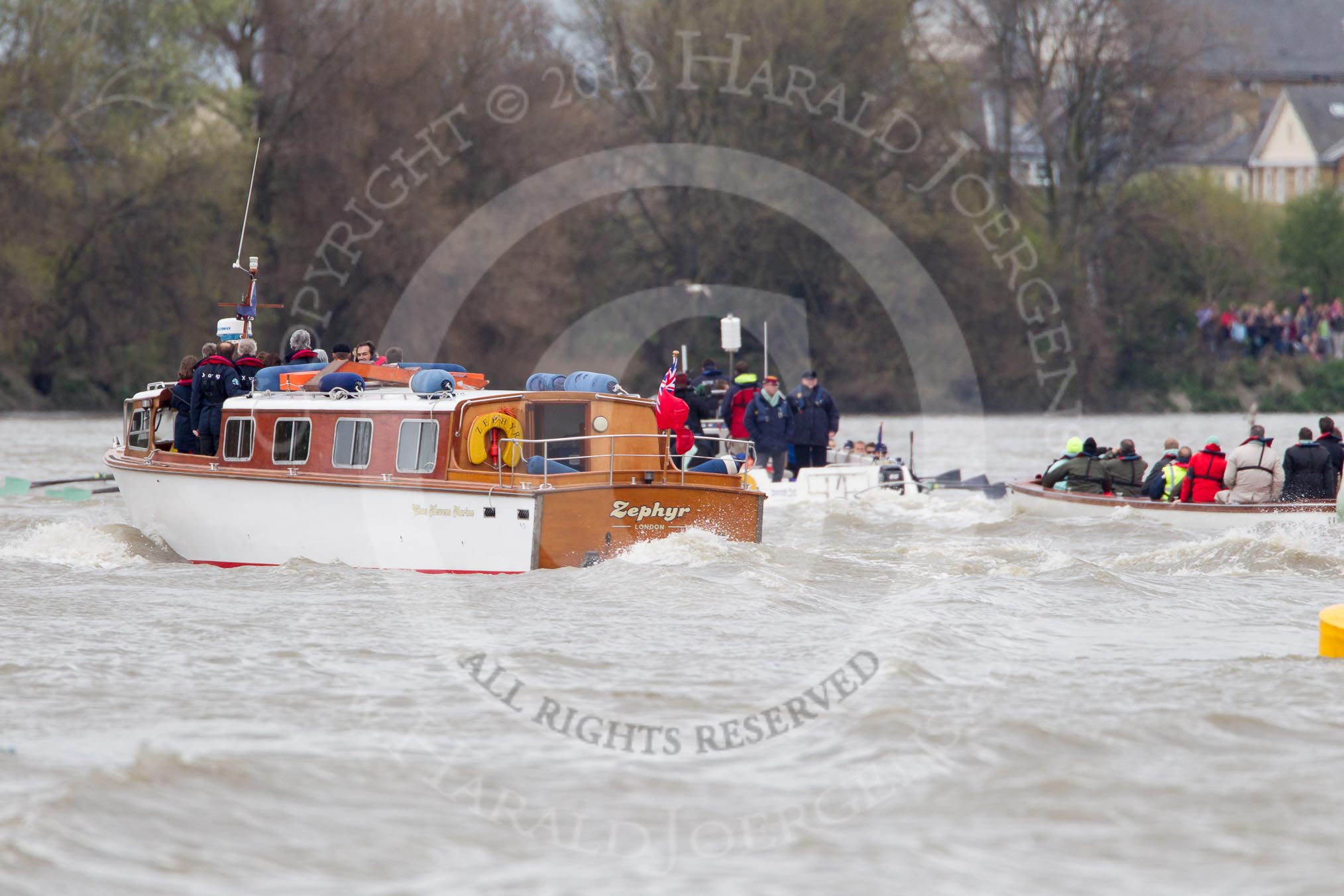 The Boat Race 2012: The 2012 Boat Race, with the boats approaching the Mile Post: On the very left the Cambridge Blue Boat, with the flotilla of boats behind, on the right of the white boat with the umpire the Oxford Blue Boat..




on 07 April 2012 at 14:17, image #277