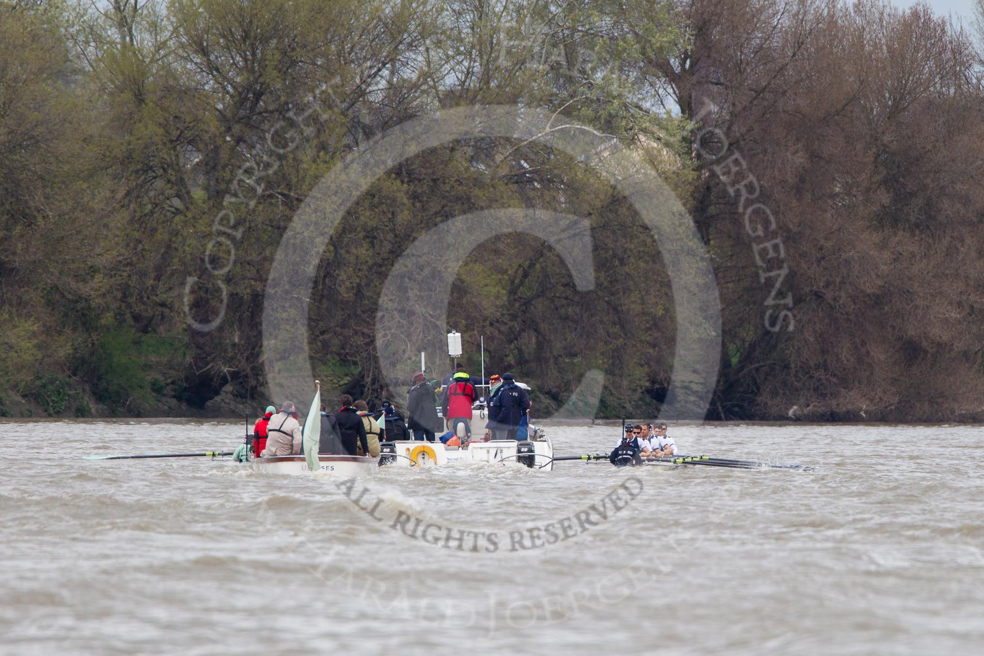 The Boat Race 2012: The 2012 Boat Race, with the boats approaching the Mile Post: The Cambridge Blue Boat on the left, Oxford Blue Boat on the right, and the boat carrying the race umpire and TV crews behind and in the middle..




on 07 April 2012 at 14:18, image #283