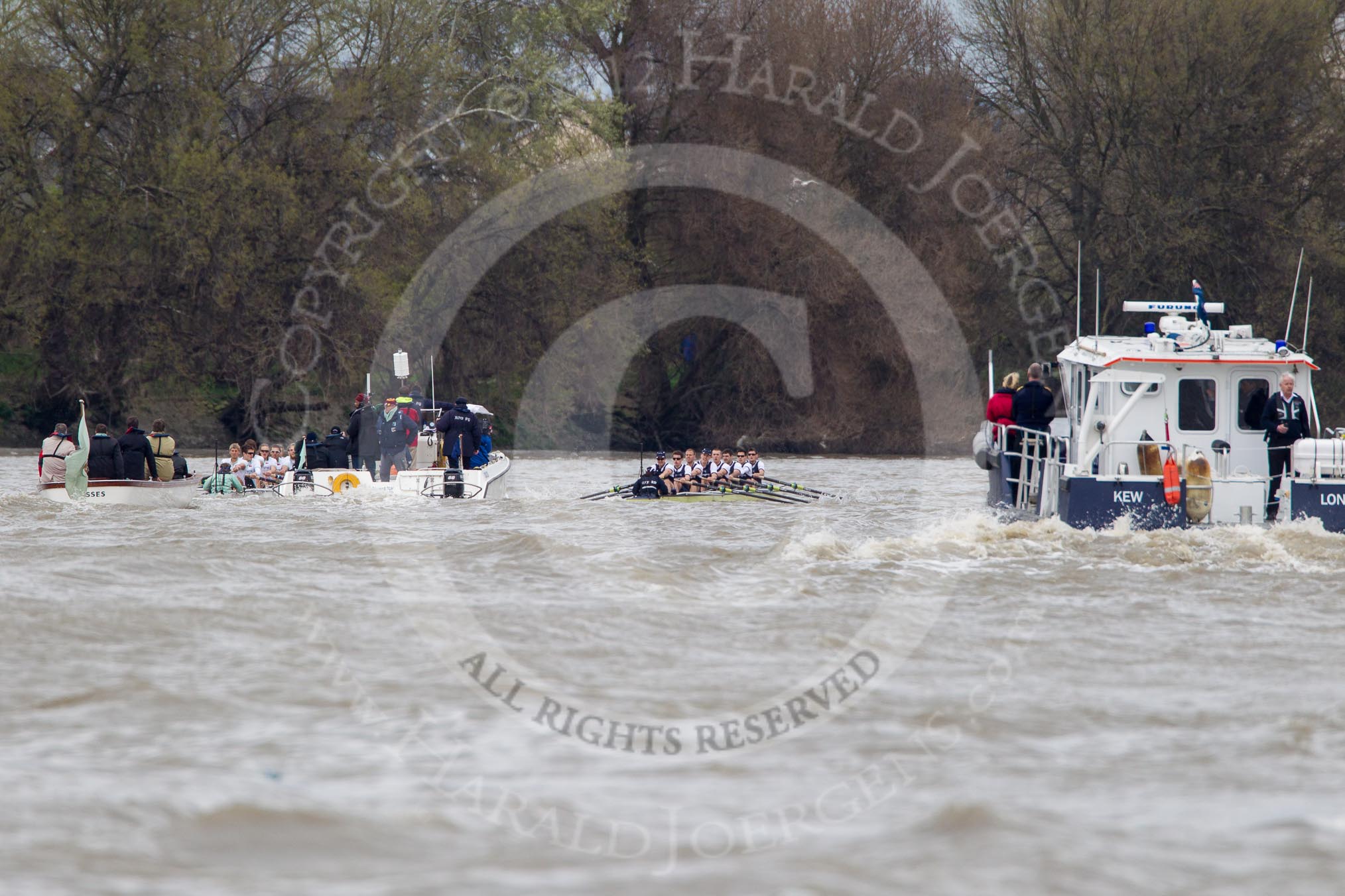 The Boat Race 2012: The 2012 Boat Race, with the boats approaching the Mile Post: The Cambridge Blue Boat on the left, Oxford Blue Boat on the right, and the boat carrying the race umpire and TV crews behind and in the middle. On the right a boat of the Port of London Harbour Master..




on 07 April 2012 at 14:18, image #284