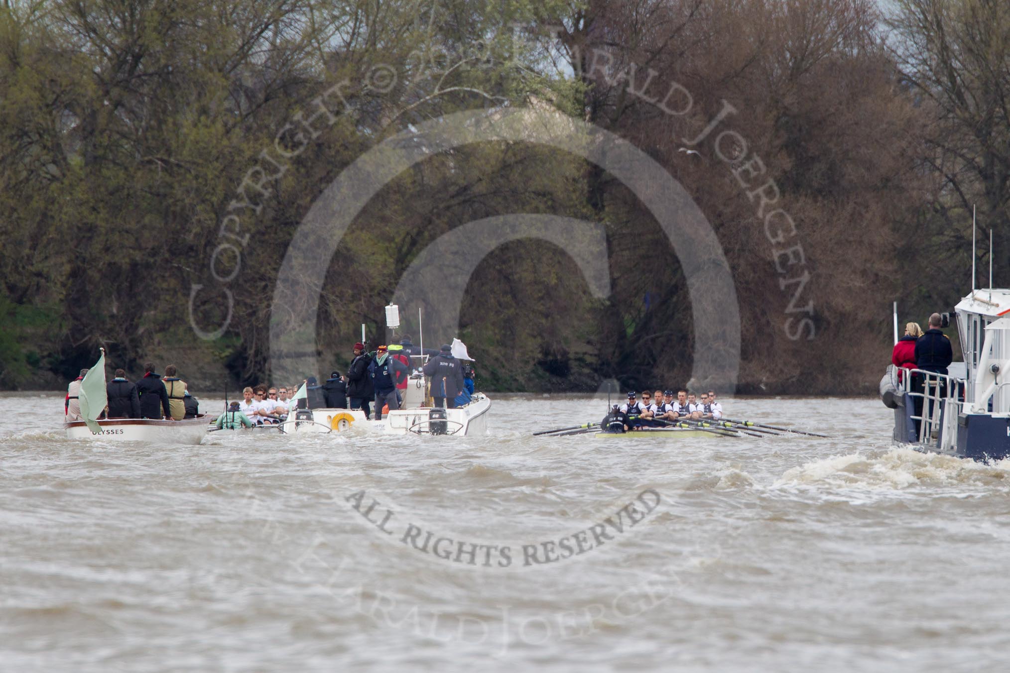Photo 1204071418201D48513HaraldJoergens The Boat Race 2012: The 2012 Boat Race, with the boats approaching the Mile Post: The Cambridge Blue Boat on the left, Oxford Blue Boat on the right, and the boat carrying the race umpire and TV crews behind and in the middle. On the right a boat of the Port of London Harbour Master..
on 07 April 2012 at 14:18, image #285