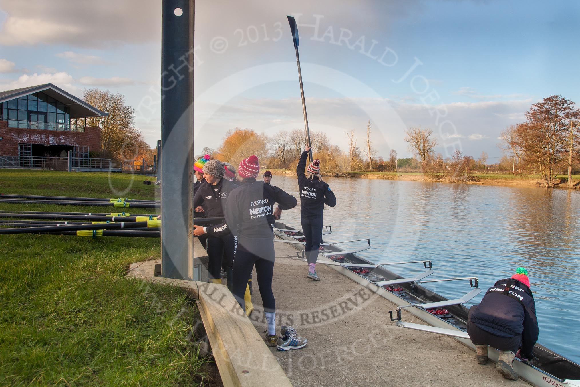 Photo 1303131649325D27389HaraldJoergens The Boat Race season 2013 - OUWBC training: The OUWBC Blue Boat squad getting ready at Fleming Boathouse - bow Mariann Novak, Alice Carrington-Windo, Mary Foord-Weston, Jo Lee, Amy Varney, Harriet Keane, Anastasia Chitty, stroke Maxie Scheske, and cox Katie Apfelbaum..
Fleming Boathouse,
Wallingford,
Oxfordshire,
United Kingdom,
on 13 March 2013 at 16:49, image #18