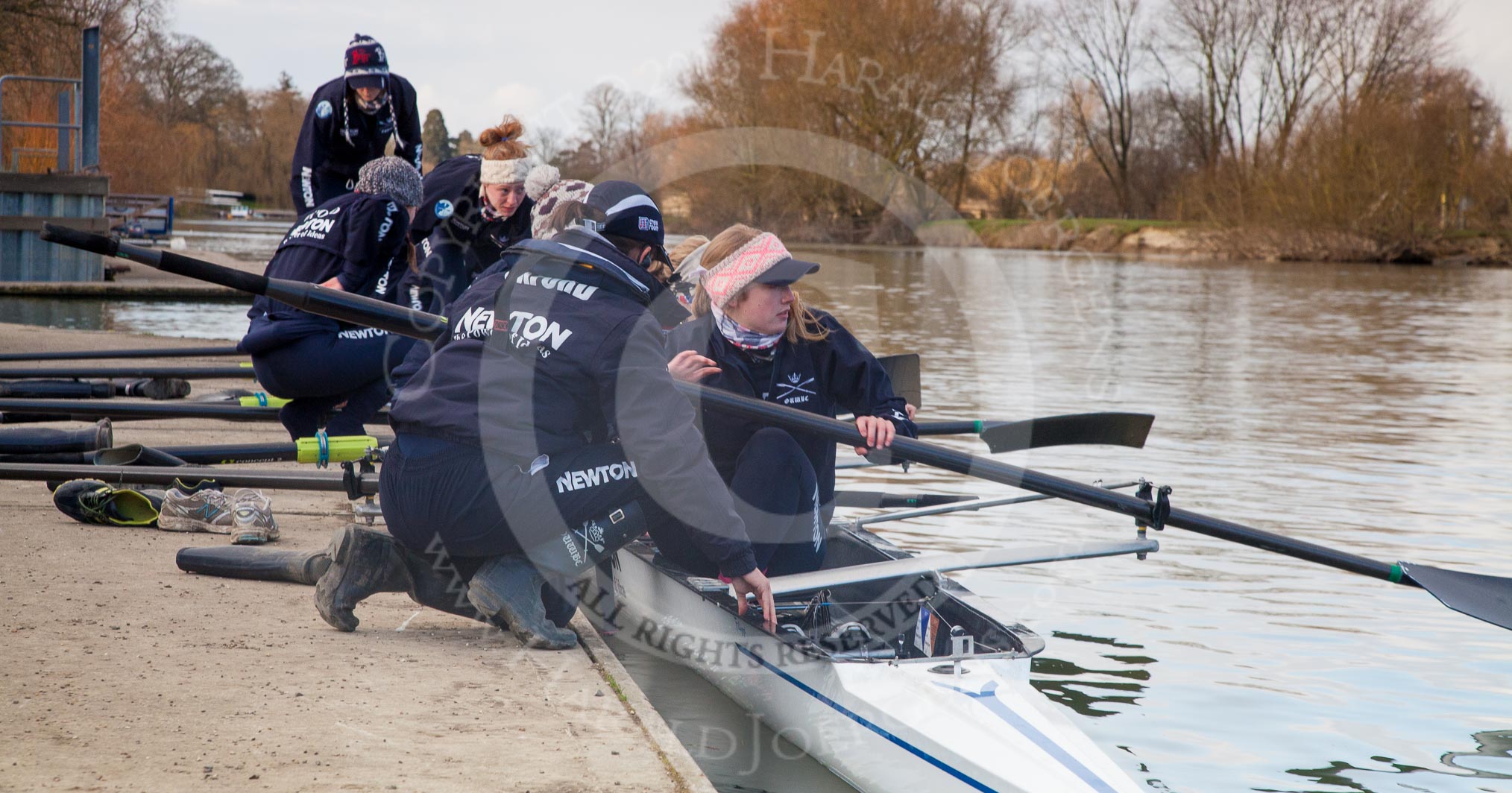 The Boat Race season 2013 - OUWBC training: The crew of Osiris, the OUWBC reserve boat, getting ready: Cox Sophie Shawdon, stroke Emily Chittock, then Annika Bruger, Caitlin Goss, Rachel Purkess, Eleanor Darlington, Hannah Ledbury, Elspeth Cumber,  and bow Coralie Viollet-Djelassi..
Fleming Boathouse,
Wallingford,
Oxfordshire,
United Kingdom,
on 13 March 2013 at 16:51, image #29