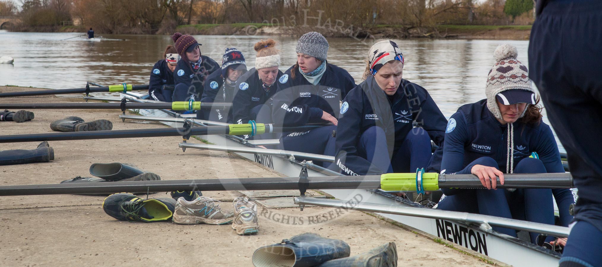 Photo 1303131652015D27436HaraldJoergens The Boat Race season 2013 - OUWBC training: The crew of Osiris, the OUWBC reserve boat, getting ready: Cox Sophie Shawdon, stroke Emily Chittock, then Annika Bruger, Caitlin Goss, Rachel Purkess, Eleanor Darlington, Hannah Ledbury, Elspeth Cumber,  and bow Coralie Viollet-Djelassi..
Fleming Boathouse,
Wallingford,
Oxfordshire,
United Kingdom,
on 13 March 2013 at 16:52, image #32