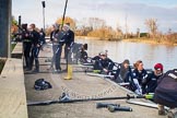 The Boat Race season 2013 - OUWBC training: The OUWBC Blue Boat squad getting ready at Fleming Boathouse - bow Mariann Novak, Alice Carrington-Windo, Mary Foord-Weston, Jo Lee, Amy Varney, Harriet Keane, Anastasia Chitty, stroke Maxie Scheske, and cox Katie Apfelbaum. In the background the Osiris crew..
Fleming Boathouse,
Wallingford,
Oxfordshire,
United Kingdom,
on 13 March 2013 at 16:50, image #26