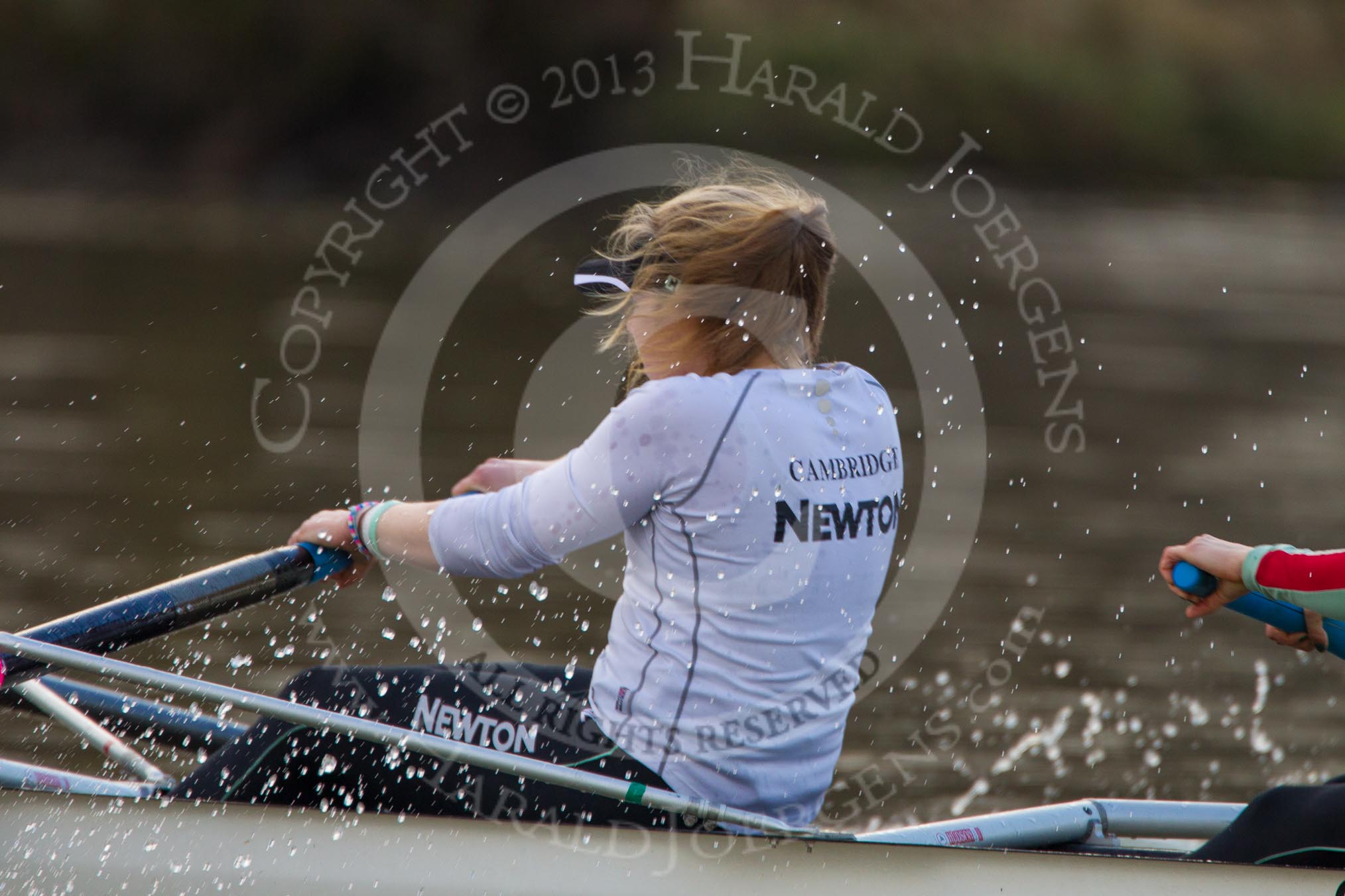 The Boat Race season 2013 - CUWBC training: Fay Sandford, in the 2 seat of the CUWBC Blue Boat, rowing in a rather wet environment..
River Thames near Remenham,
Henley-on-Thames,
Oxfordshire,
United Kingdom,
on 19 March 2013 at 16:30, image #149