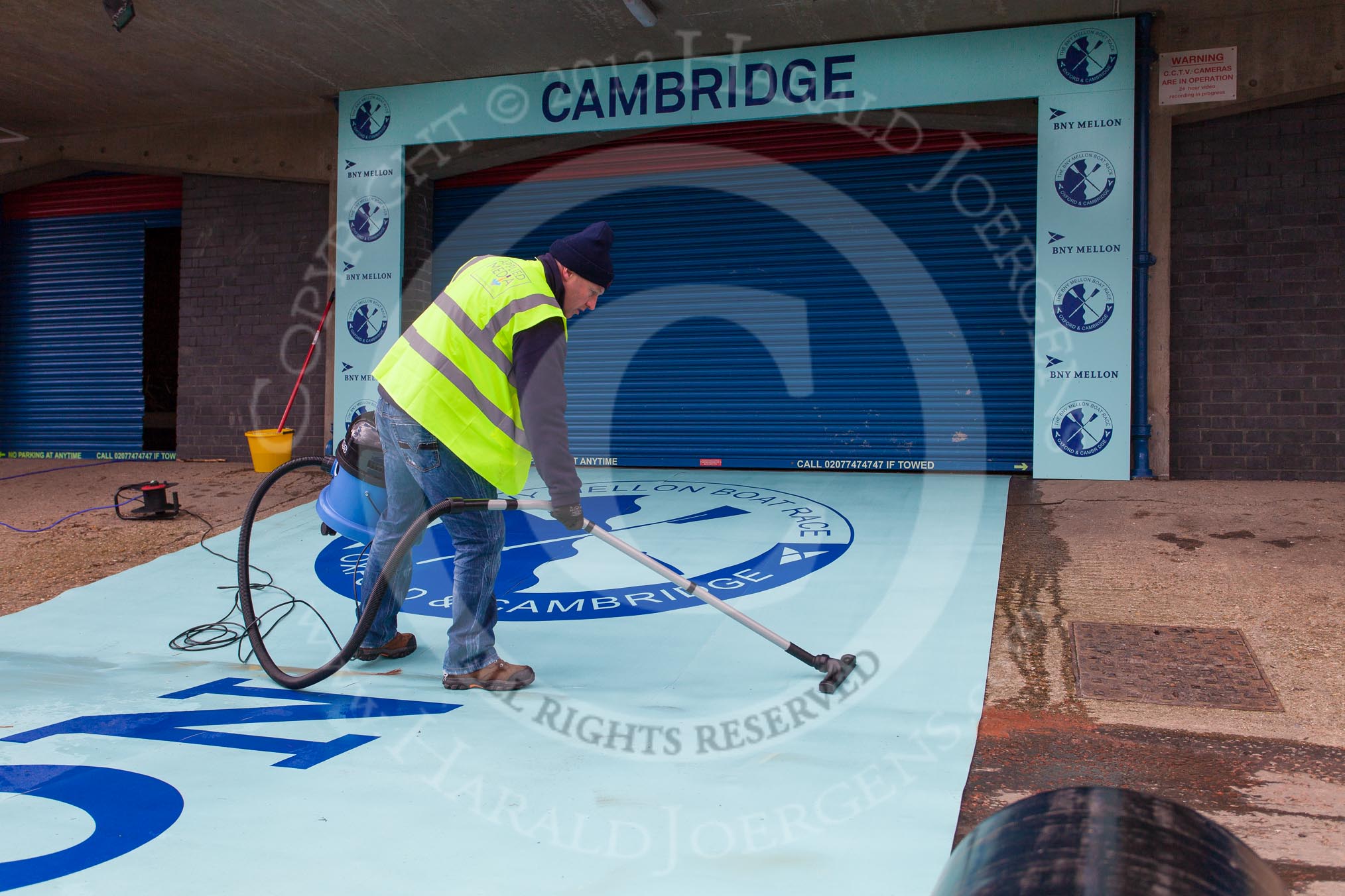 The Boat Race 2013: Cleaning the light blue carpet for the Cambridge squad, hours before the 2013 Boat Race..
Putney,
London SW15,

United Kingdom,
on 31 March 2013 at 11:08, image #6