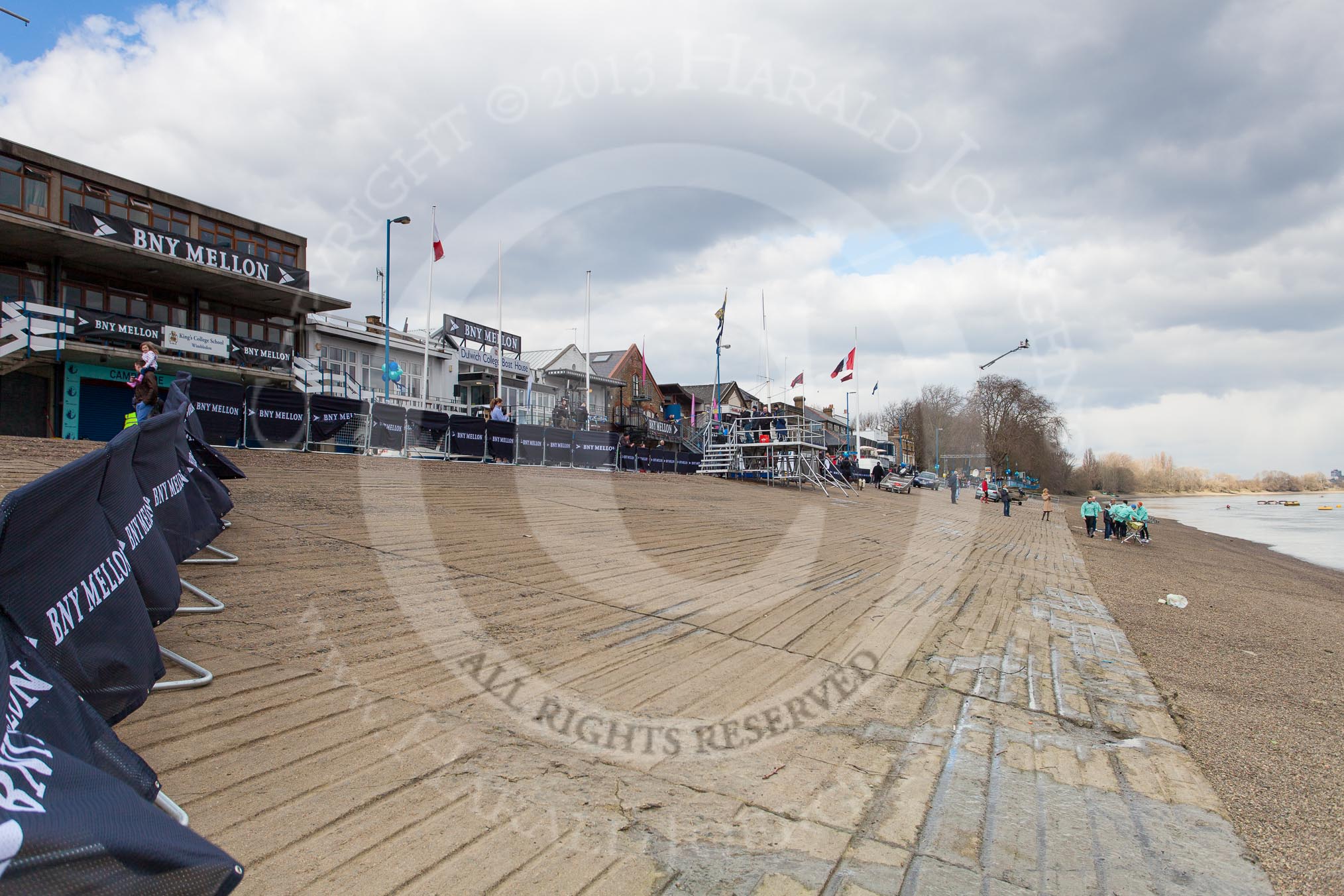 The Boat Race 2013: Barriers covered with logos of the Boat Race sponsor BNY Mellon, in the centre of the image a platform that will be used by the BBC for interviews and commentary..
Putney,
London SW15,

United Kingdom,
on 31 March 2013 at 11:12, image #9