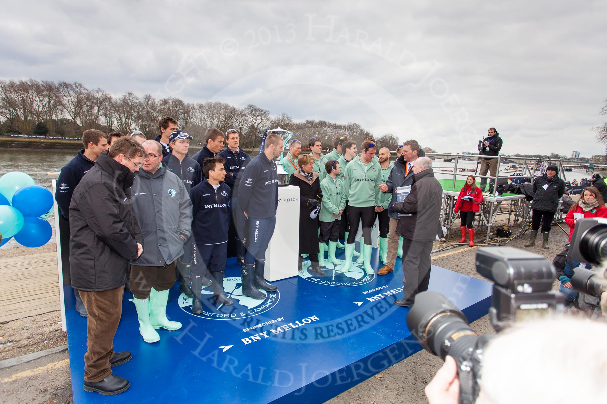 The Boat Race 2013: Moments before the "toss for stations" for the 2013 Boat Race, the Oxford and Cambridge crews standing next to the Boat Race Trophy with BBC Sport commentator Clare Balding and Boat Race umpire Sir Matthew Pinsent..
Putney,
London SW15,

United Kingdom,
on 31 March 2013 at 14:45, image #93