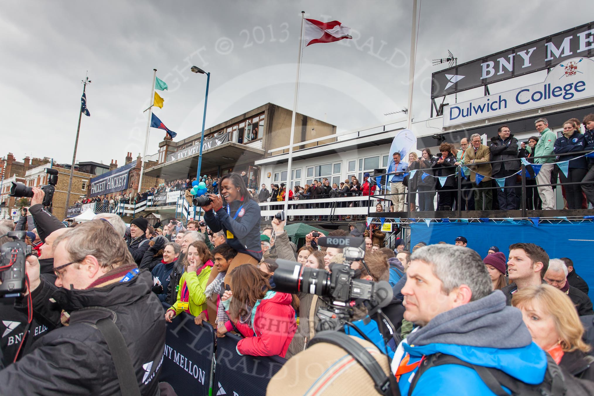 The Boat Race 2013: Crowds gathered along Putney Embankment and on the balconies of the boathouses for the "toss for stations" for the 2013 Boat Race..
Putney,
London SW15,

United Kingdom,
on 31 March 2013 at 14:46, image #94