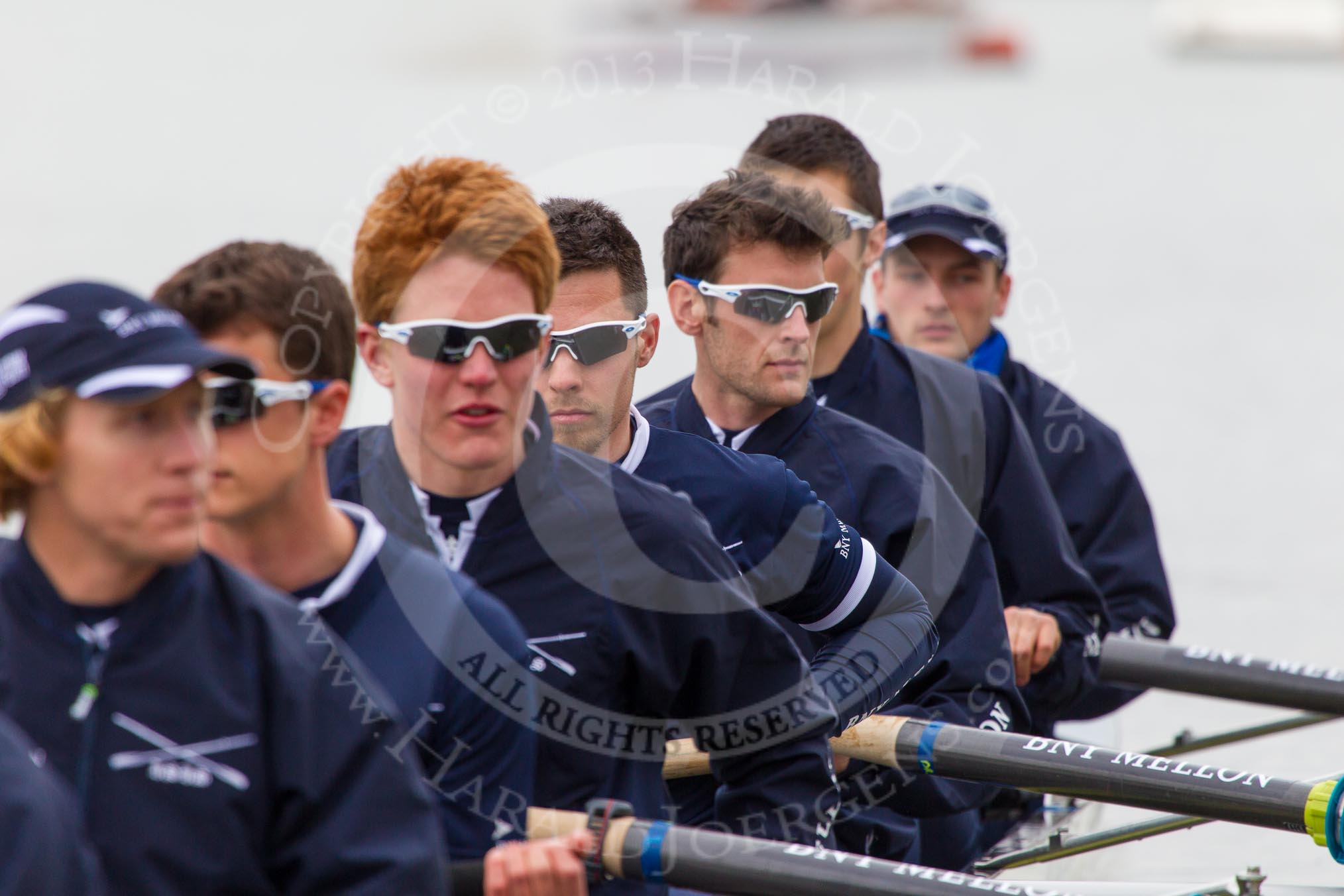 The Boat Race 2013: The crew of the Oxford reserve boat Isis getting ready for the Isis/Goldie race, here 7 seat Rev'd James Stephenson, 6 Benjamin French, 5 Joseph Dawson, 4 William Zeng, 3 Dr Alexander Woods, 2 Nicholas Hazell, and at bow Iain Mandale..
Putney,
London SW15,

United Kingdom,
on 31 March 2013 at 15:16, image #119