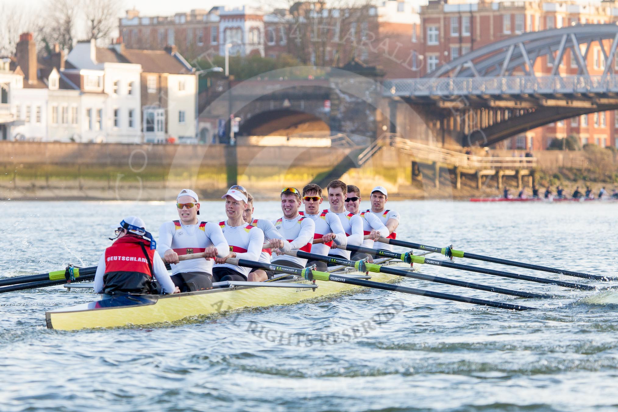 The Boat Race season 2014 - fixture OUBC vs German U23: The German U23 boat during the second race, approaching Barnes Railway Bridge: Cox Torben Johannesen, stroke Eike Kutzki, 7 Ole Schwiethal, 6 Arne Schwiethal, 5 Johannes Weissenfeld, 4 Maximilian Korge, 3 Malte Daberkow, 2 Finn Knuppel, bow Jonas Wiesen..
River Thames between Putney Bridge and Chiswick Bridge,



on 08 March 2014 at 17:07, image #233