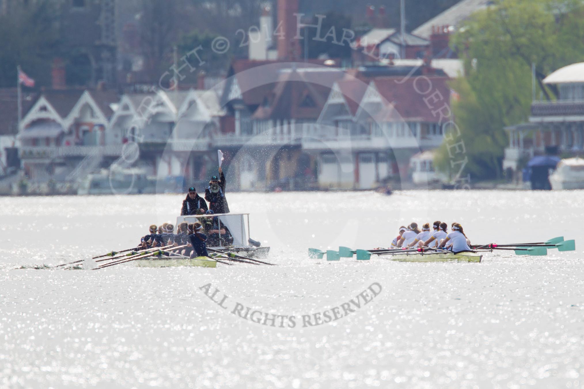 The Women's Boat Race and Henley Boat Races 2014: The Women's Reserves - Osiris v. Blondie race. Osiris (Oxford) on the left,  and Blondie (Cambridge) are getting close enough to be warned by the race umpire..
River Thames,
Henley-on-Thames,
Buckinghamshire,
United Kingdom,
on 30 March 2014 at 14:15, image #140