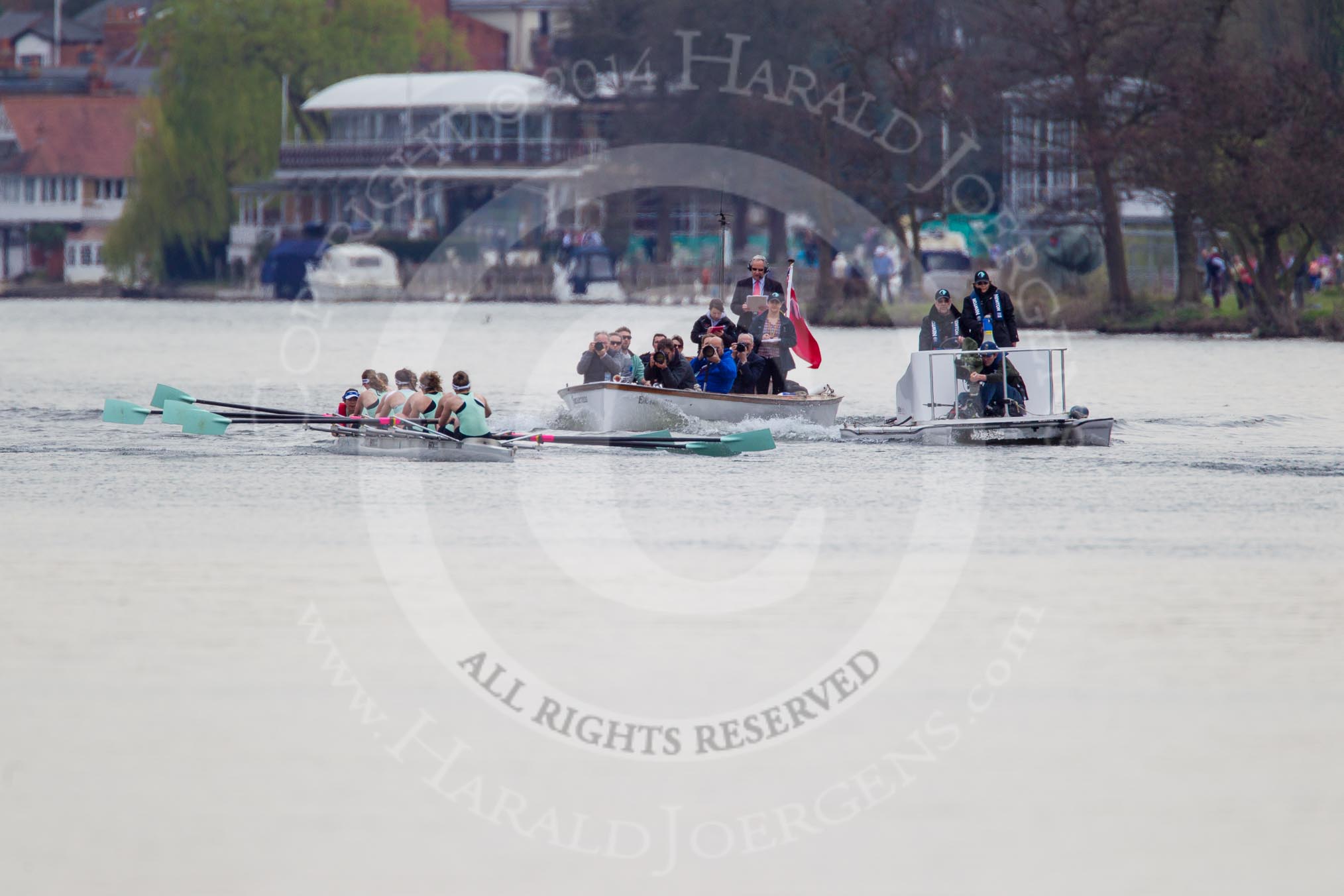 The Women's Boat Race and Henley Boat Races 2014: The Newton Women's Boat Race: The Cambridge Eight is followed by the press launch and the umpire's boat with a TV cameraman at the front..
River Thames,
Henley-on-Thames,
Buckinghamshire,
United Kingdom,
on 30 March 2014 at 15:13, image #284