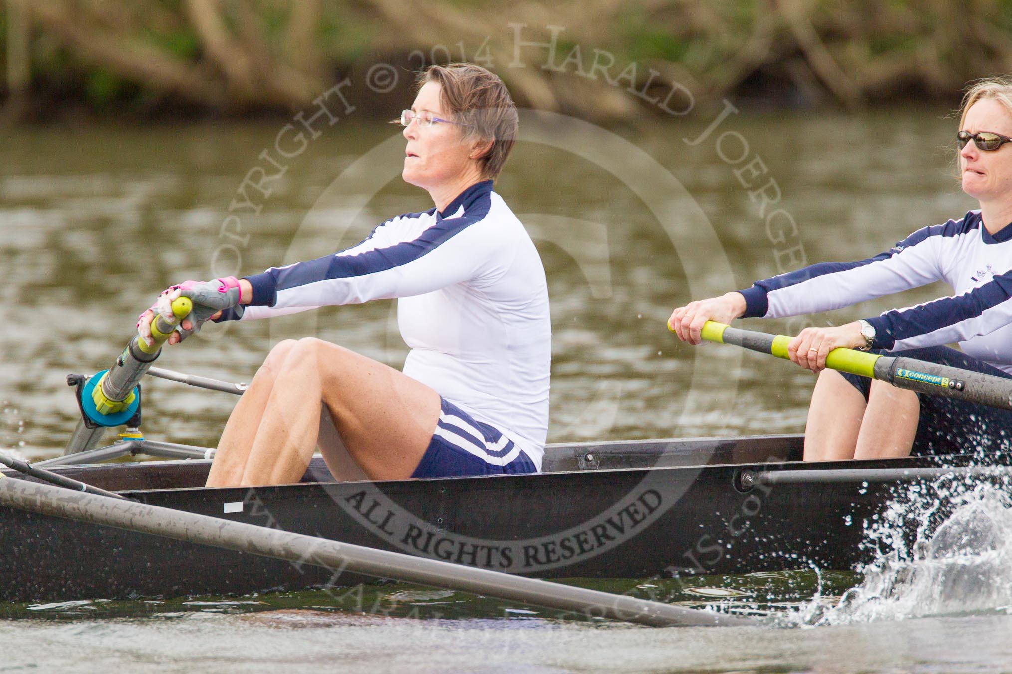 The Women's Boat Race and Henley Boat Races 2014: The Commemorative Row Past of the 1984 inaugural crews of the Oxford and Cambridge Women’s Lightweight races, to celebrate 30 years at Henley: In the OUWBC boat 4 seat Emma Kelly (Platt), 3 Laura Evison (Oldfield)..
River Thames,
Henley-on-Thames,
Buckinghamshire,
United Kingdom,
on 30 March 2014 at 15:55, image #449