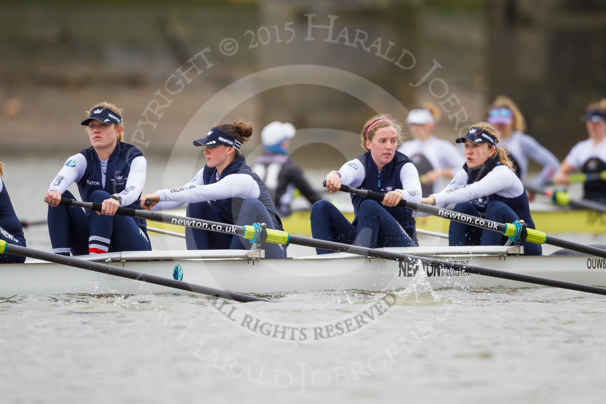 The OUWBC boat - Emily Reynolds, Shelley Pearson, Anastasia Chitty, and Maxie Scheske at bow, with the Molesey BC boat in the background.