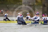 The OUWBC boat - cox Jennifer Ehr, Caryn Davies, and Nadine Gradel Iberg. In the background is the Molesey BC boat.