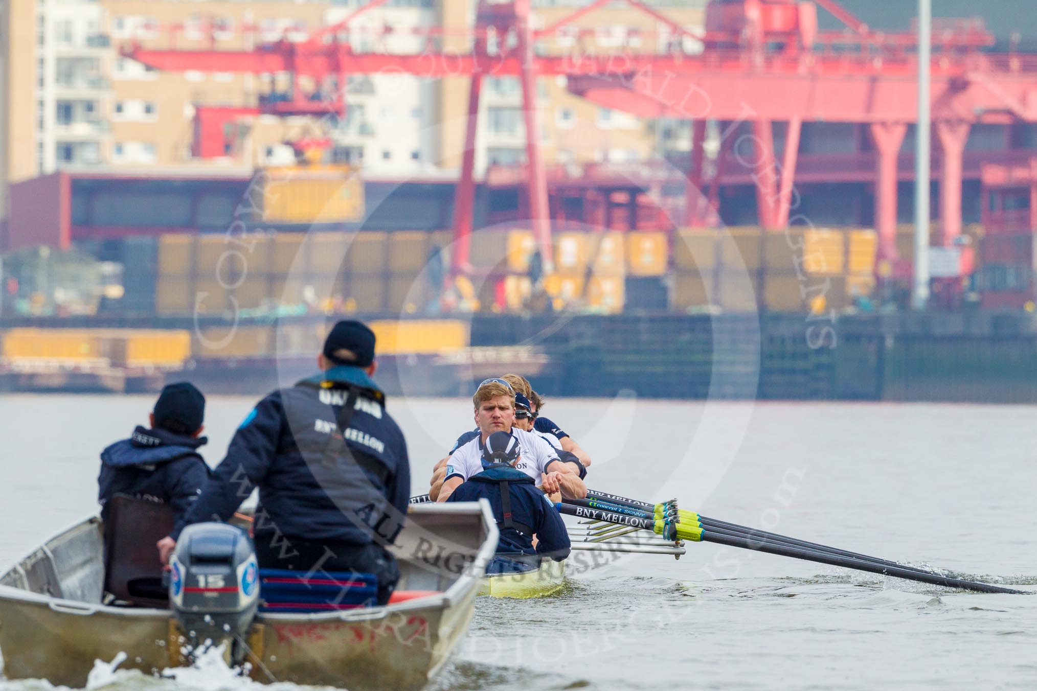 The OUBC Blue Boat, followed by coach Sean Bowden