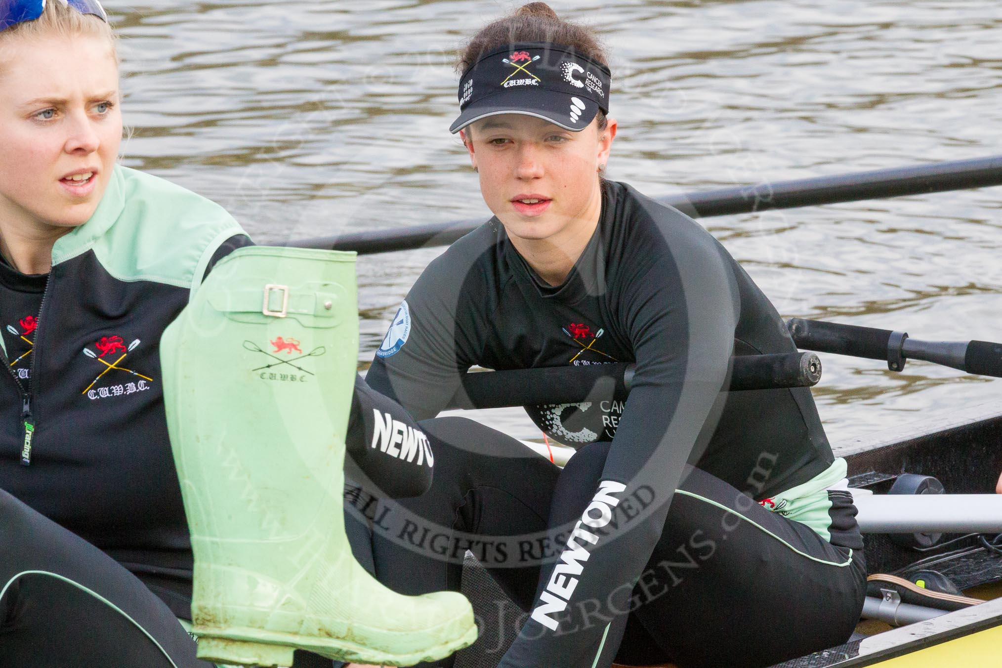 The Boat Race season 2017 - Women's Boat Race Fixture CUWBC vs Univerity of London: CUWBC's 5, Holly Hill, and 4 Imogen Grant getting rid of their Wellies.
River Thames between Putney Bridge and Mortlake,
London SW15,

United Kingdom,
on 19 February 2017 at 15:17, image #11
