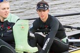 The Boat Race season 2017 - Women's Boat Race Fixture CUWBC vs Univerity of London: CUWBC's 5, Holly Hill, and 4 Imogen Grant getting rid of their Wellies.
River Thames between Putney Bridge and Mortlake,
London SW15,

United Kingdom,
on 19 February 2017 at 15:17, image #11