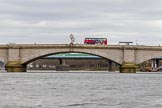 The Cancer Research UK Boat Race season 2017 - Women's Boat Race Fixture OUWBC vs Molesey BC: Putney Bridge on an overcast day, with a red London bus.
River Thames between Putney Bridge and Mortlake,
London SW15,

United Kingdom,
on 19 March 2017 at 15:36, image #32