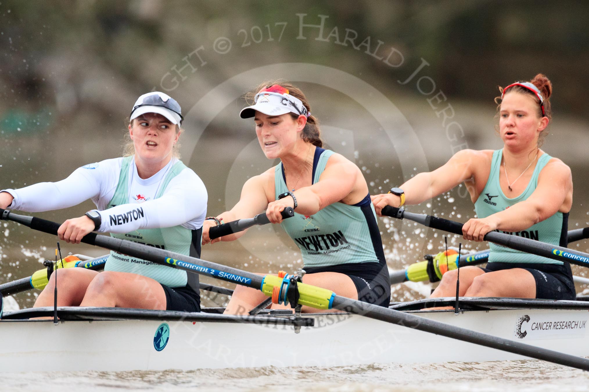 The Boat Race season 2018 - Women's Boat Race Trial Eights (CUWBC, Cambridge): Expecto Patronum  near Hammersmith Bridge, here 7 Myriam Goudet-Boukhatmi, 6 Larkin Sayre, 5 Tricia Smith.
River Thames between Putney Bridge and Mortlake,
London SW15,

United Kingdom,
on 05 December 2017 at 12:48, image #97