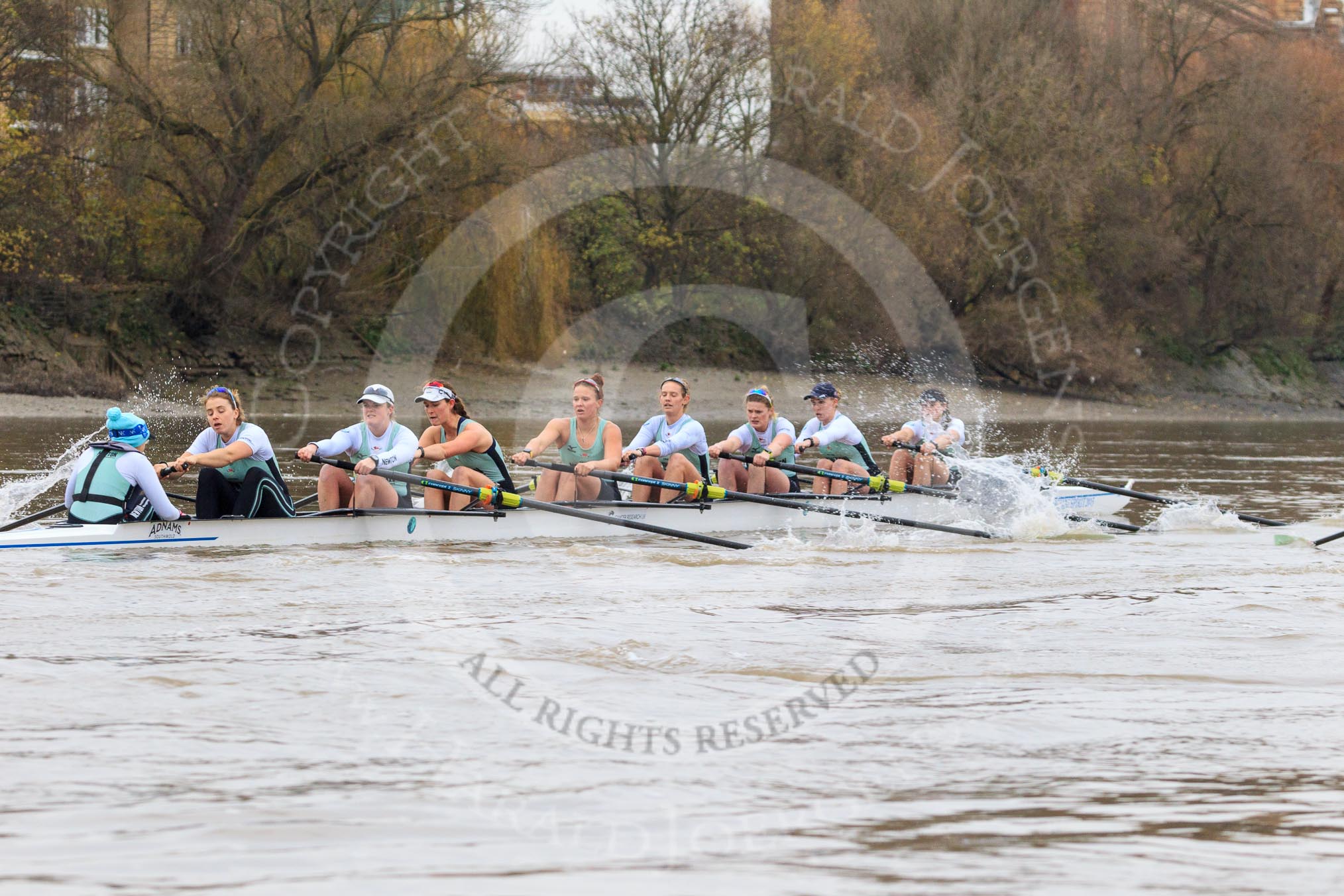 The Boat Race season 2018 - Women's Boat Race Trial Eights (CUWBC, Cambridge): Expecto Patronum, still trailing near Harrods Repository, with cox-Sophie Shapter, stroke-Alice White,  7-Abigail Parker, 6-Thea Zabell, 5-Kelsey Barolak, 4-Laura Foster, 3-Sally O Brien, 2-Millie Perrin, bow-Eve Caroe.
River Thames between Putney Bridge and Mortlake,
London SW15,

United Kingdom,
on 05 December 2017 at 12:48, image #94
