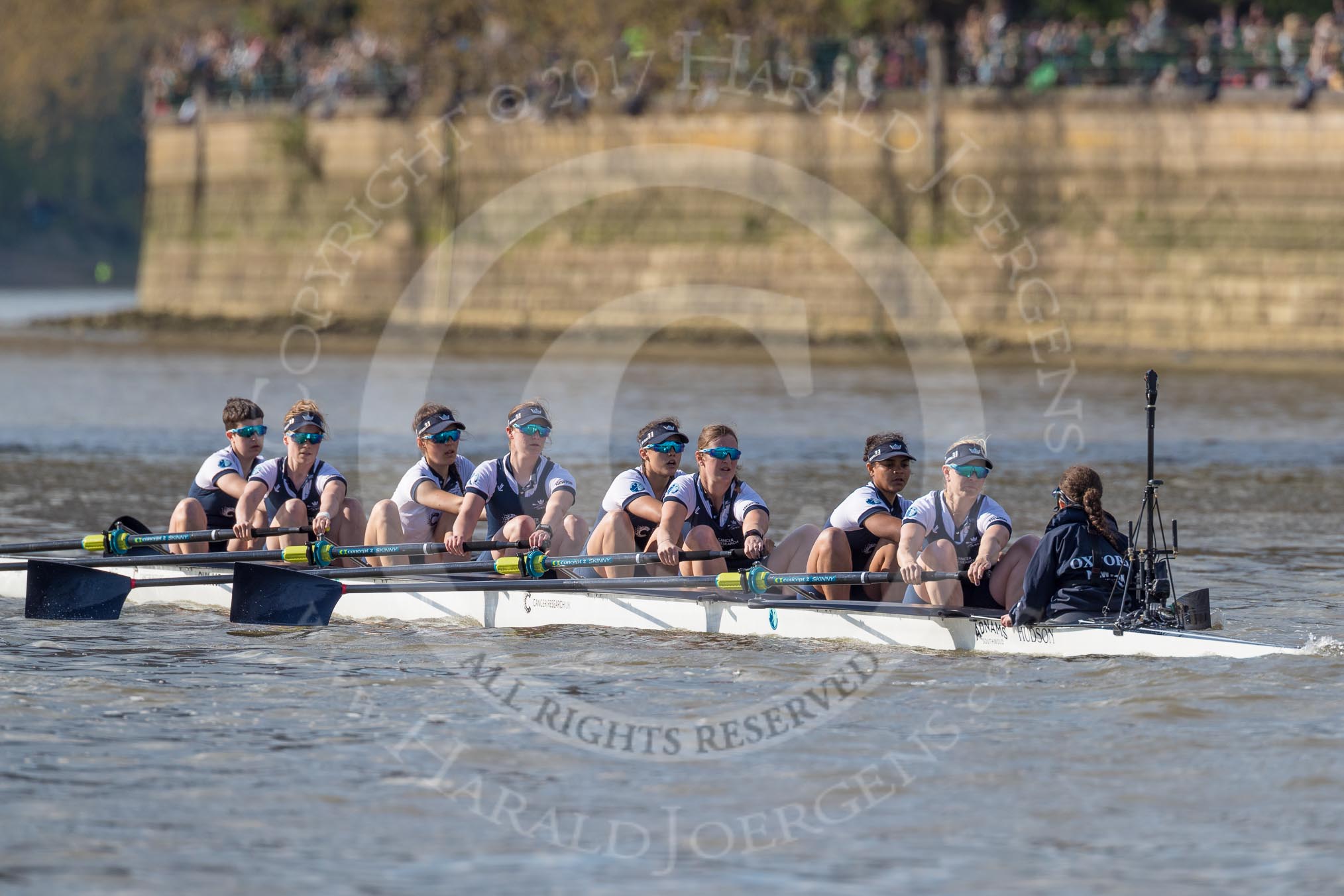 The Boat Race season 2017 -  The Cancer Research Women's Boat Race: OUWBC approaching Putney Bridge before the start of the Women's Boat Race - bow Alice Roberts, 2 Flo Pickles, 3 Rebecca Te Water Naudé, 4 Rebecca Esselstein, 5 Chloe Laverack, 6 Harriet Austin, 7 Jenna Hebert, stroke Emily Cameron, cox Eleanor Shearer.
River Thames between Putney Bridge and Mortlake,
London SW15,

United Kingdom,
on 02 April 2017 at 16:25, image #103