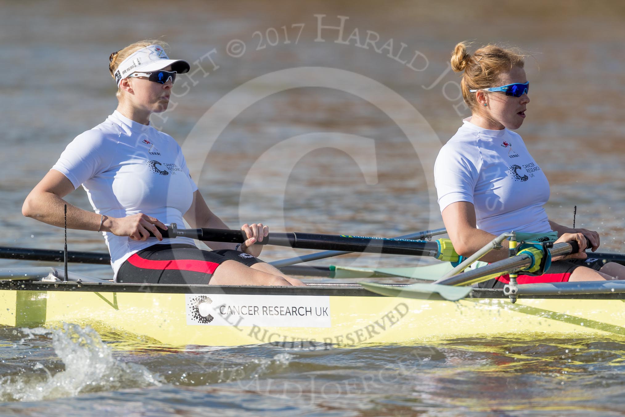 The Boat Race season 2017 -  The Cancer Research Women's Boat Race: CUWBC about to reach the start of the Women's Boat Race, here 5 seat Holly Hill, 6 seat Alice White.
River Thames between Putney Bridge and Mortlake,
London SW15,

United Kingdom,
on 02 April 2017 at 16:25, image #108