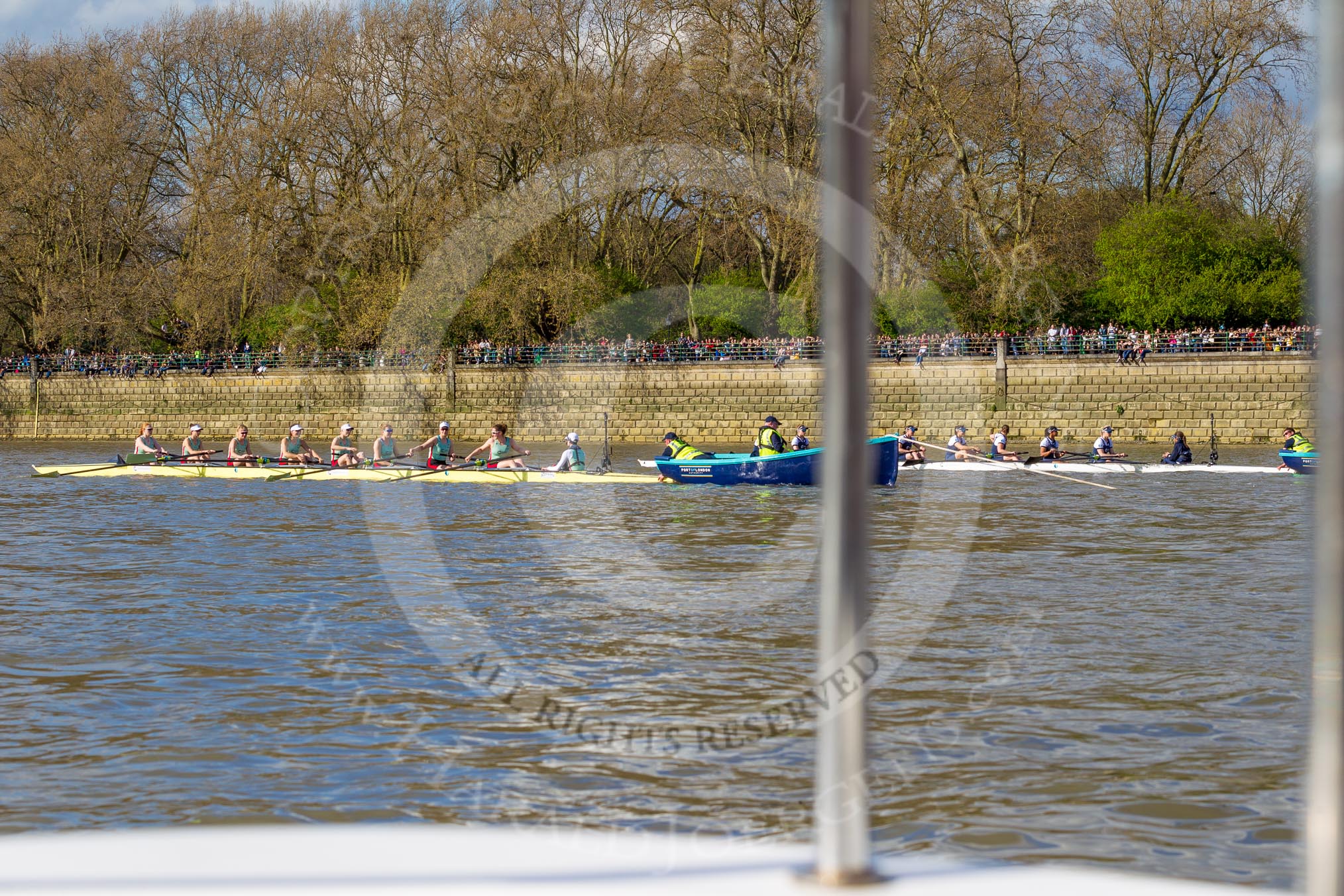 The Boat Race season 2017 -  The Cancer Research Women's Boat Race: The CUWBC and OUWBC boats getting ready for the start of the Women's Boat Race, both boats held in position by the stake boat crews.
River Thames between Putney Bridge and Mortlake,
London SW15,

United Kingdom,
on 02 April 2017 at 16:31, image #116