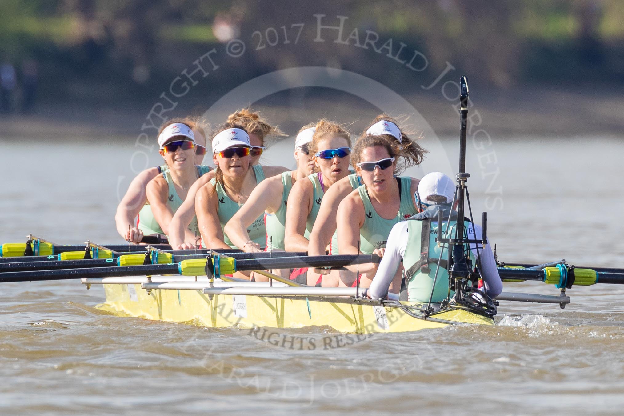 The Boat Race season 2017 -  The Cancer Research Women's Boat Race: CUWBC with a comfortable lead (bow Ashton Brown, 2 Imogen Grant, 3 Claire Lambe, 4 Anna Dawson, 5 Holly Hill, 6 Alice White, 7 Myriam Goudet, stroke Melissa Wilson, cox Matthew Holland) with hair flying the the wind.
River Thames between Putney Bridge and Mortlake,
London SW15,

United Kingdom,
on 02 April 2017 at 16:36, image #135