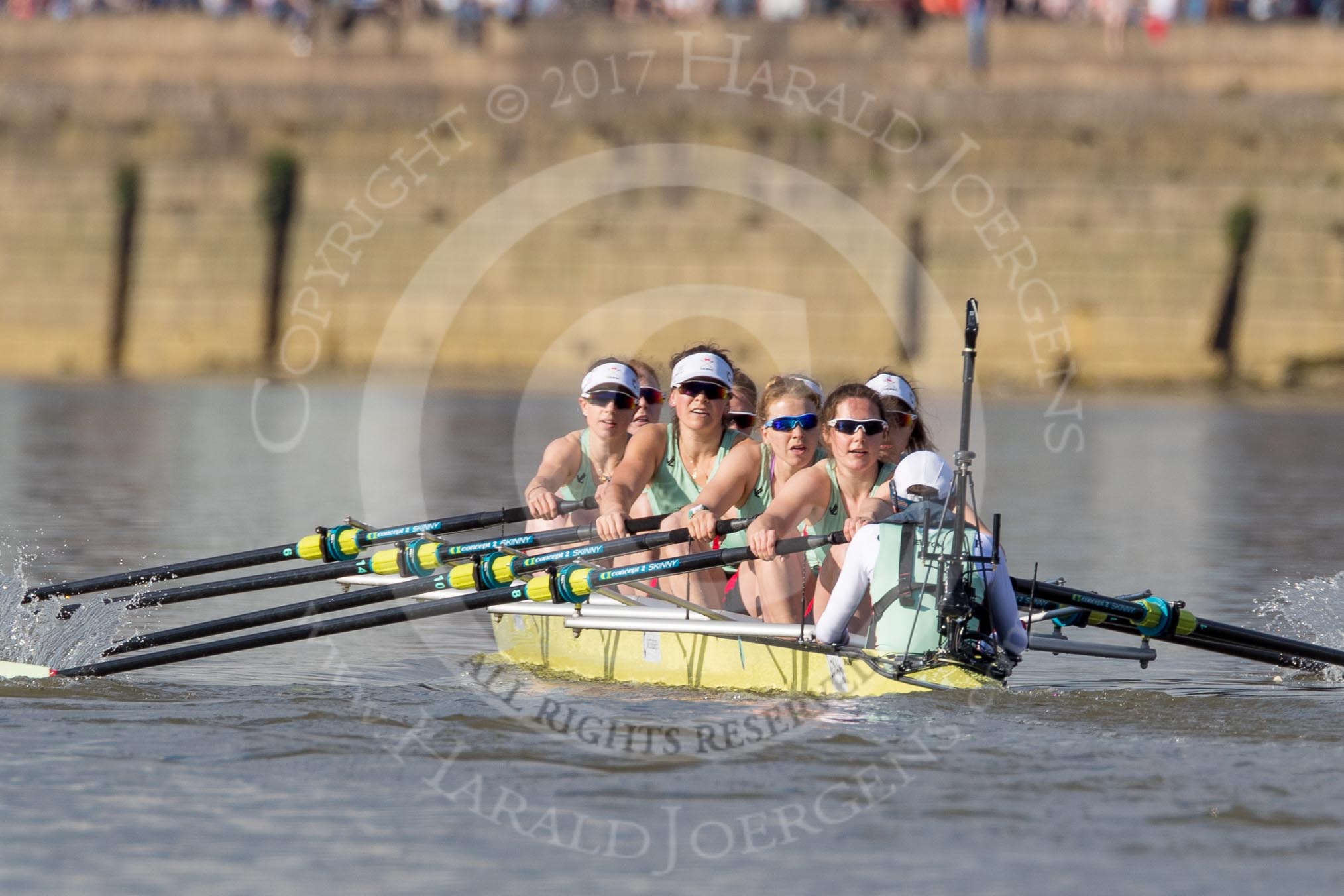 Photo 1704021639151X29511HaraldJoergens The Boat Race season 2017 - The Cancer Research Women's Boat Race: Cambridge is keeping their comfortable lead on the approach to Hammersmith Bridge - bow Ashton Brown, 2 Imogen Grant, 3 Claire Lambe, 4 Anna Dawson, 5 Holly Hill, 6 Alice White, 7 Myriam Goudet, stroke Melissa Wilson, cox Matthew Holland.
River Thames between Putney Bridge and Mortlake,
London SW15,
United Kingdom,
on 02 April 2017 at 16:39, image #145