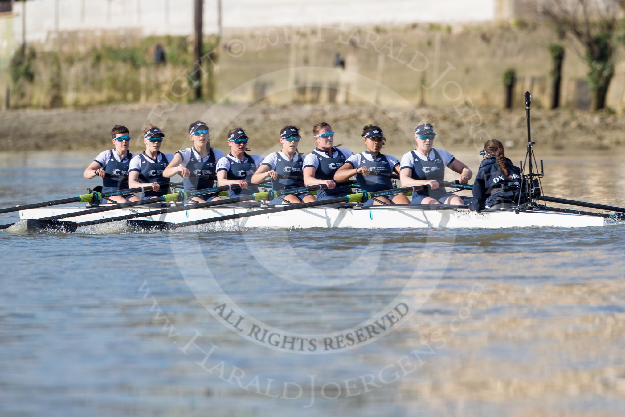 The Boat Race season 2017 -  The Cancer Research Women's Boat Race: OUWBC working hard to catch up with Cambridge, here bow Alice Roberts, 2 Flo Pickles, 3 Rebecca Te Water Naudé, 4 Rebecca Esselstein, 5 Chloe Laverack, 6 Harriet Austin, 7 Jenna Hebert, stroke Emily Cameron, cox Eleanor Shearer.
River Thames between Putney Bridge and Mortlake,
London SW15,

United Kingdom,
on 02 April 2017 at 16:41, image #156