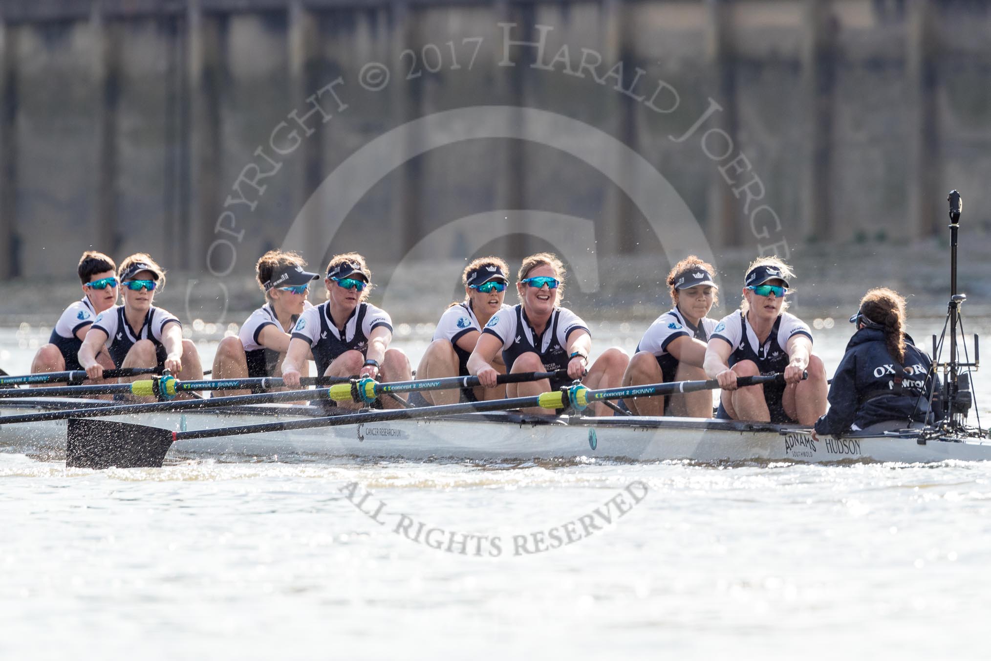 The Boat Race season 2017 -  The Cancer Research Women's Boat Race: Oxford working hard to catch up with Cambridge in the afternoon sunshine - bow Alice Roberts, 2 Flo Pickles, 3 Rebecca Te Water Naudé, 4 Rebecca Esselstein, 5 Chloe Laverack, 6 Harriet Austin, 7 Jenna Hebert, stroke Emily Cameron, cox Eleanor Shearer.
River Thames between Putney Bridge and Mortlake,
London SW15,

United Kingdom,
on 02 April 2017 at 16:47, image #170