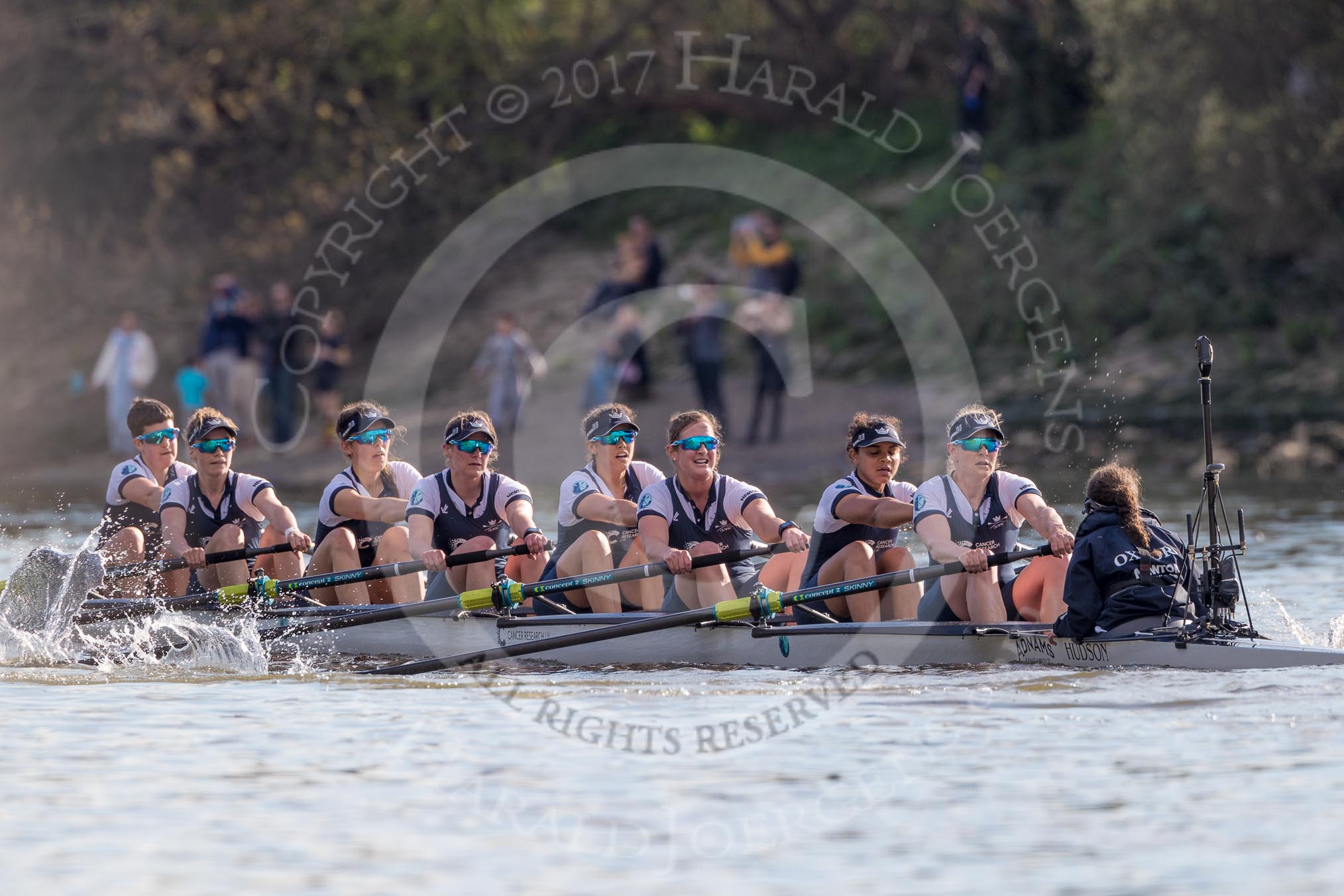 The Boat Race season 2017 -  The Cancer Research Women's Boat Race: Oxford working hard to catch up with Cambridge in the afternoon sunshine - bow Alice Roberts, 2 Flo Pickles, 3 Rebecca Te Water Naudé, 4 Rebecca Esselstein, 5 Chloe Laverack, 6 Harriet Austin, 7 Jenna Hebert, stroke Emily Cameron, cox Eleanor Shearer.
River Thames between Putney Bridge and Mortlake,
London SW15,

United Kingdom,
on 02 April 2017 at 16:48, image #172