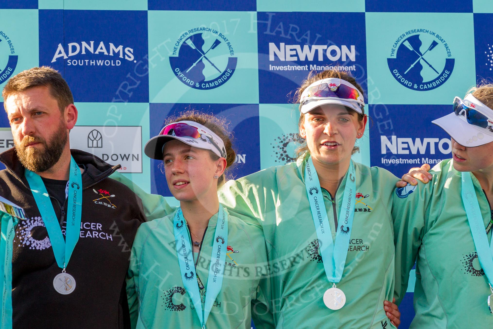 The Boat Race season 2017 -  The Cancer Research Women's Boat Race: CUWBC with their medals at the price giving ceremony, here head coach Rob Barker, 2 seat Imogen Grant,.
River Thames between Putney Bridge and Mortlake,
London SW15,

United Kingdom,
on 02 April 2017 at 17:12, image #243