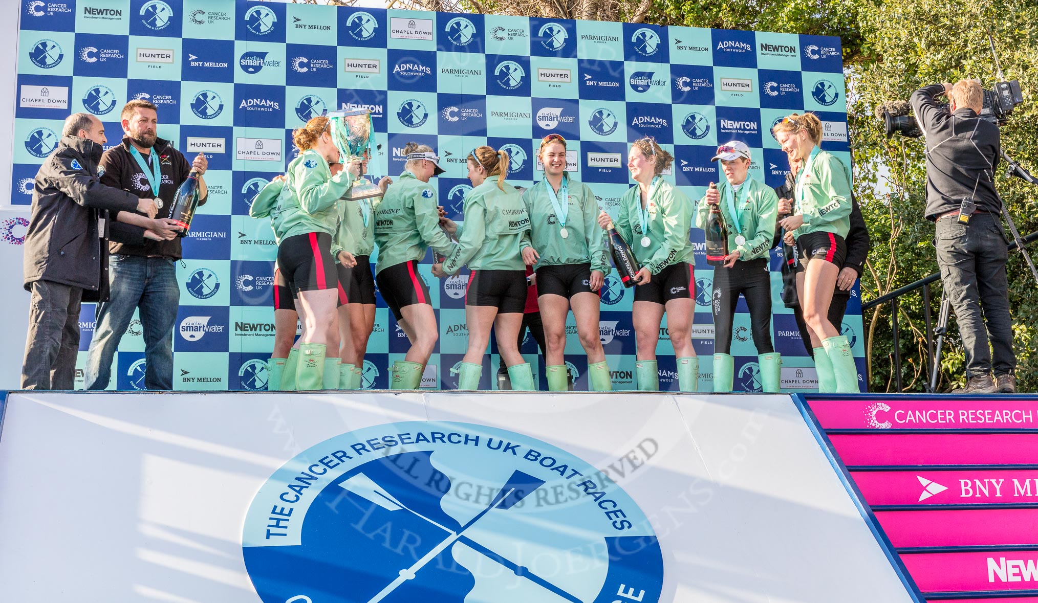 The Boat Race season 2017 -  The Cancer Research Women's Boat Race: CUWBC about to spray the Champagne at the price giving.
River Thames between Putney Bridge and Mortlake,
London SW15,

United Kingdom,
on 02 April 2017 at 17:13, image #255