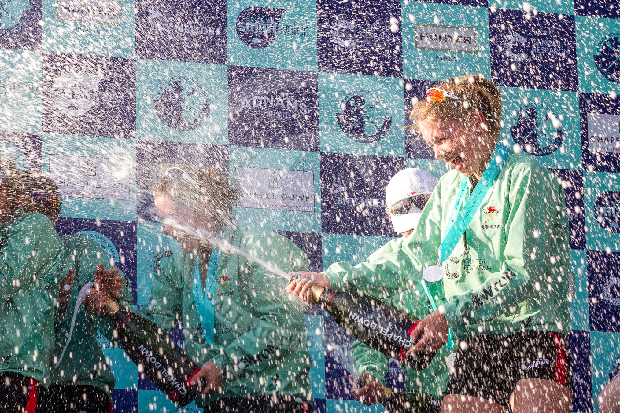 The Boat Race season 2017 -  The Cancer Research Women's Boat Race: CUWBC covered in spray (Cahmpagne, not Thames water) at the price giving.
River Thames between Putney Bridge and Mortlake,
London SW15,

United Kingdom,
on 02 April 2017 at 17:13, image #265