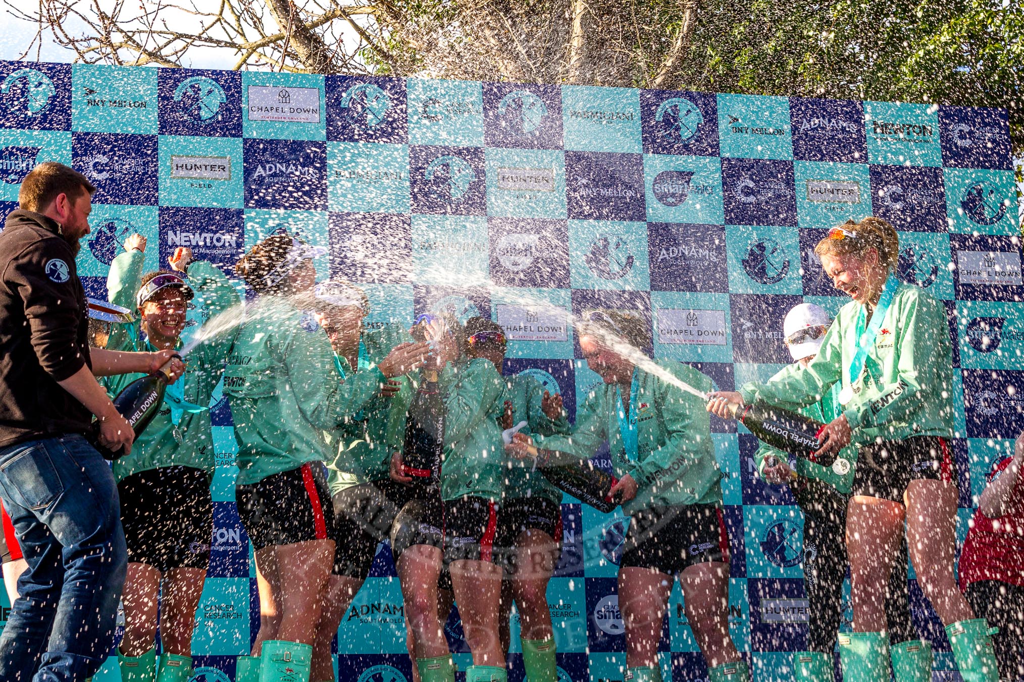 The Boat Race season 2017 -  The Cancer Research Women's Boat Race: CUWBC covered in spray (Cahmpagne, not Thames water) at the price giving.
River Thames between Putney Bridge and Mortlake,
London SW15,

United Kingdom,
on 02 April 2017 at 17:13, image #266