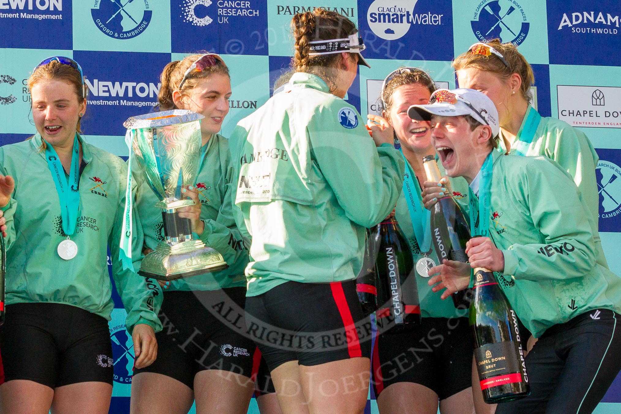 The Boat Race season 2017 -  The Cancer Research Women's Boat Race: CUWBC with the Womwn's Boat Race trophy at the price giving - 6 Alice White, 7 Myriam Goudet with the trophy, and on the right stroke Melissa Wilson, 4 Anna Dawson, and cox Matthew Holland.
River Thames between Putney Bridge and Mortlake,
London SW15,

United Kingdom,
on 02 April 2017 at 17:13, image #294