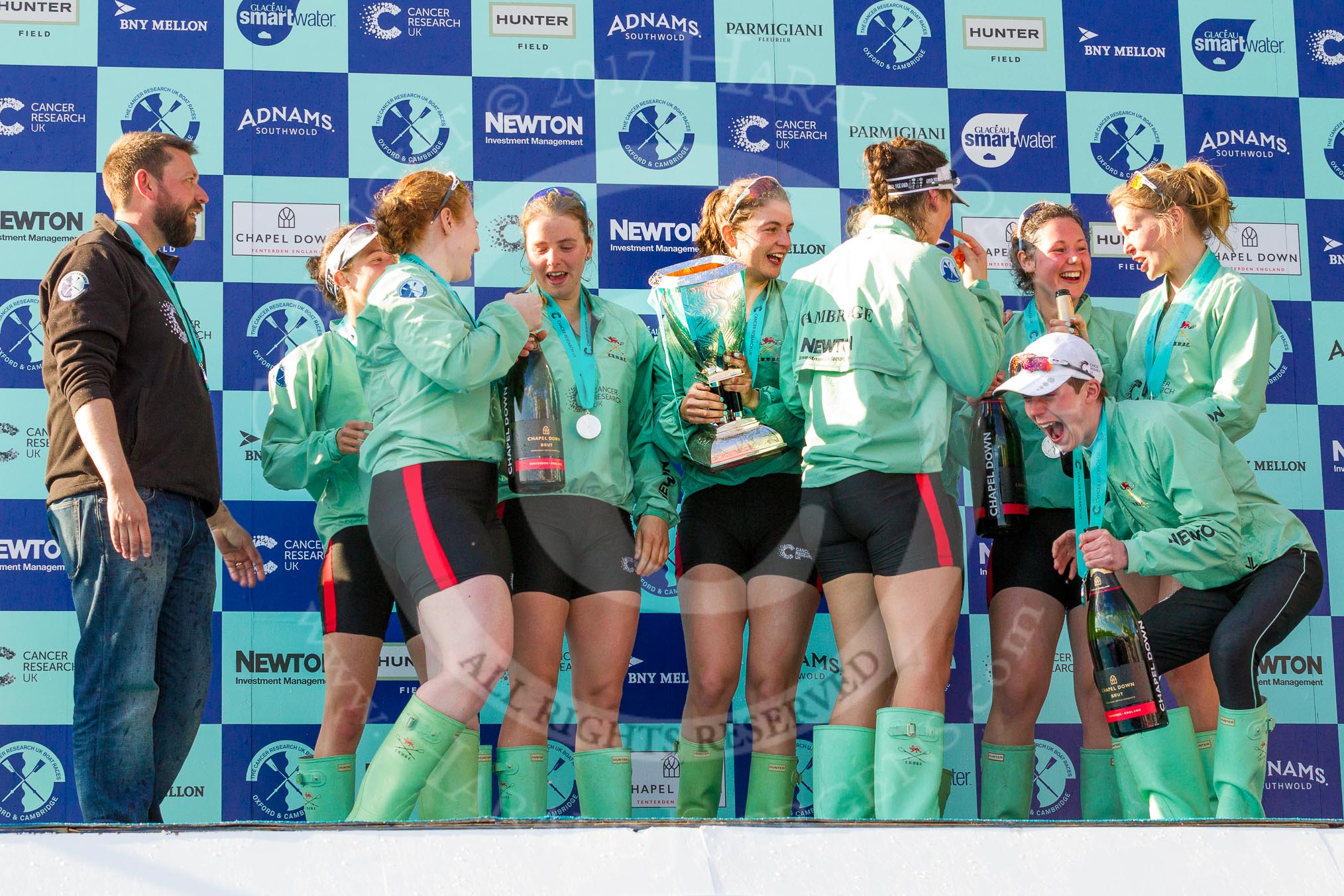 The Boat Race season 2017 -  The Cancer Research Women's Boat Race: CUWBC with the Womwn's Boat Race trophy at the price giving - head coach Rob Baker, bow Ashton Brown, 2 Imogen Grant, 6 Alice White, 7 Myriam Goudet, and on the right stroke Melissa Wilson and 4 Anna Dawson.
River Thames between Putney Bridge and Mortlake,
London SW15,

United Kingdom,
on 02 April 2017 at 17:13, image #295