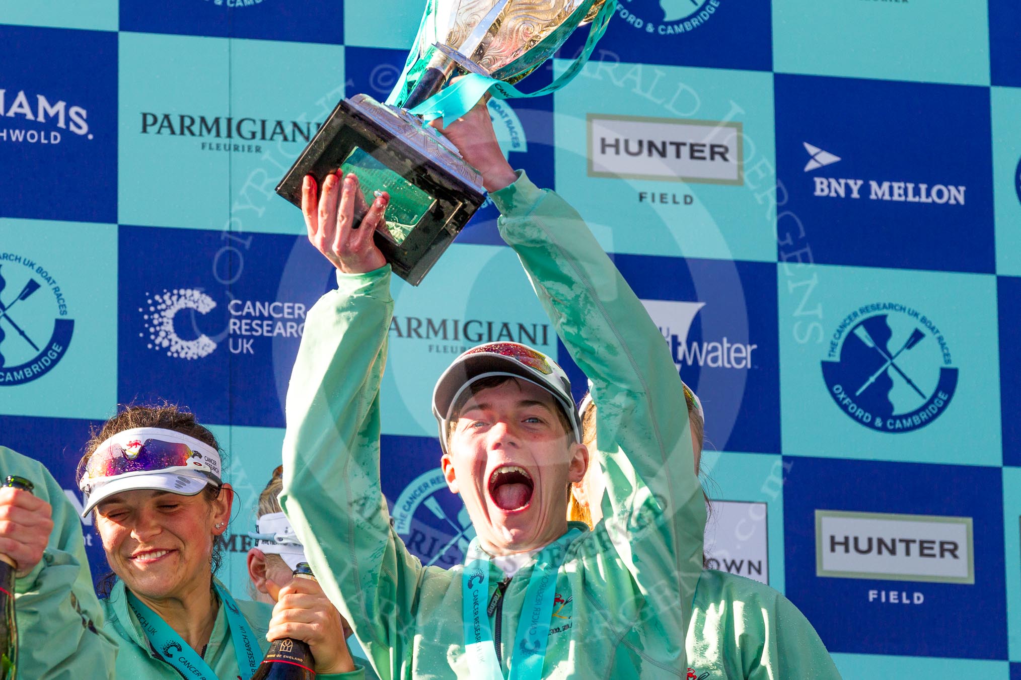 The Boat Race season 2017 -  The Cancer Research Women's Boat Race: CUWBC with the Womwn's Boat Race trophy at the price giving - and a very excited cox Matthew Holland with the Women's Boat Race trophy.
River Thames between Putney Bridge and Mortlake,
London SW15,

United Kingdom,
on 02 April 2017 at 17:14, image #297