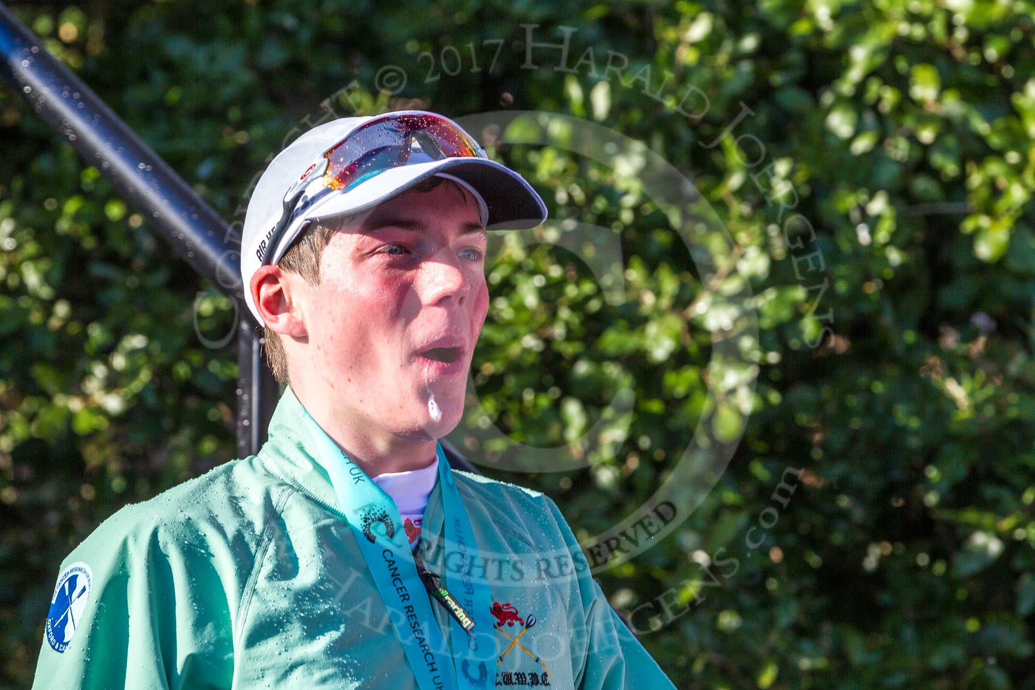 The Boat Race season 2017 -  The Cancer Research Women's Boat Race: CUWBC cox Matthew Holland, covered in Champagne, leaving the price giving.
River Thames between Putney Bridge and Mortlake,
London SW15,

United Kingdom,
on 02 April 2017 at 17:14, image #302