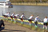The Boat Race season 2017 -  The Cancer Research Women's Boat Race: The CUWBC crew getting their boat onto the river, here stroke Melissa Wilson, 7 Myriam Goudet, 6 Alice White, 5 Holly Hill, 4 Anna Dawson, 3 Claire Lambe, 2 Imogen Grant, bow Ashton Brown.
River Thames between Putney Bridge and Mortlake,
London SW15,

United Kingdom,
on 02 April 2017 at 15:47, image #61