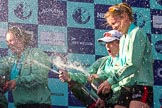 The Boat Race season 2017 -  The Cancer Research Women's Boat Race: CUWBC spraying the Champagne at the price giving - stroke Melissa Wilson, and cox Matthew Holland, and 4 seat Anna Dawson.
River Thames between Putney Bridge and Mortlake,
London SW15,

United Kingdom,
on 02 April 2017 at 17:13, image #268