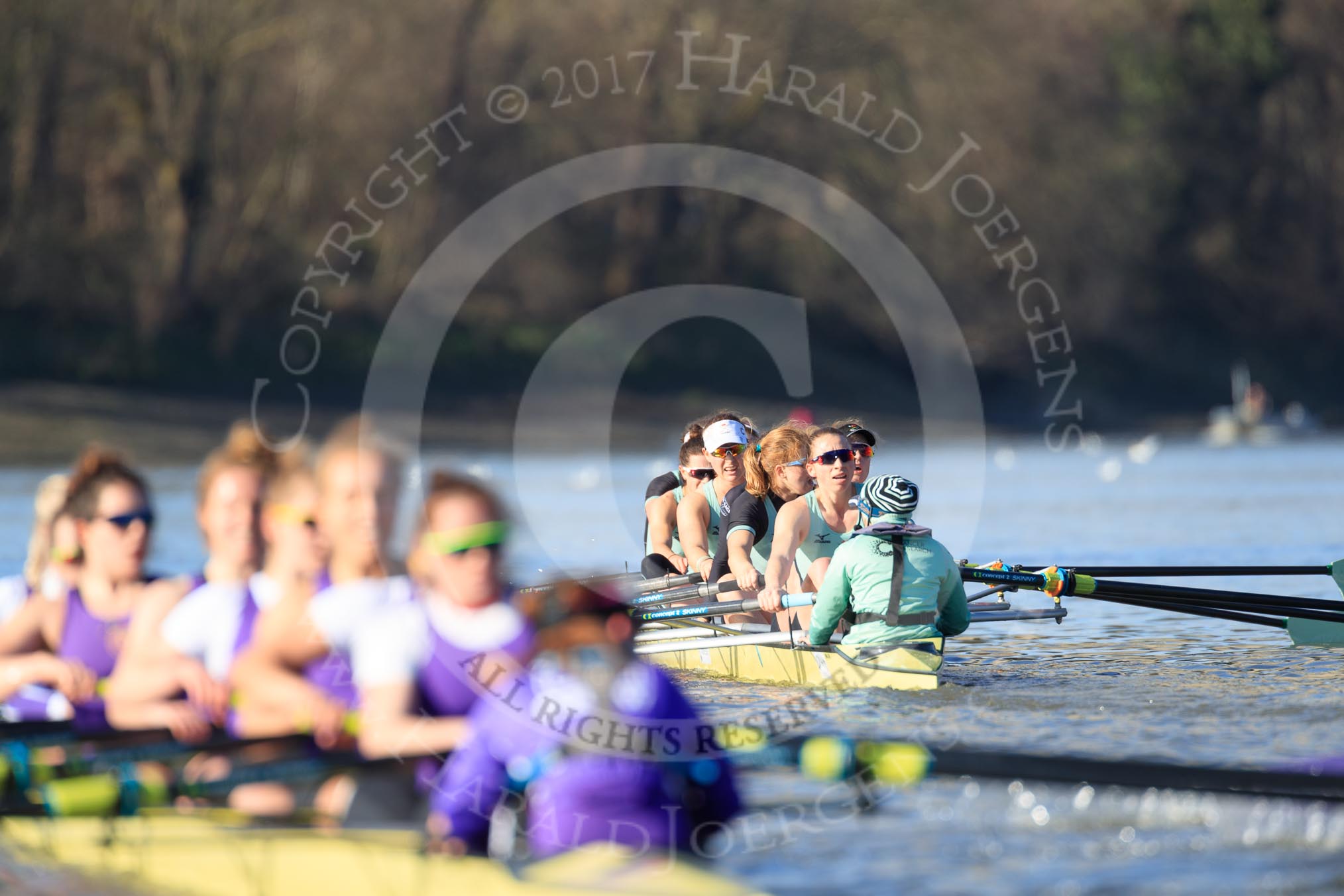 The Women's Boat Race season 2018 - fixture CUWBC vs. ULBC: ULBC and CUWBC - here, in the Cambridge  boat, just having crossed the finish line, bow Olivia Coffey, 2 Myriam Goudet-Boukhatmi, 3 Alice White, 4 Paula Wesselmann, 5 Thea Zabell, 6 Anne Beenken, 7 Imogen Grant, stroke Tricia Smith, cox Sophie Shapter.
River Thames between Putney Bridge and Mortlake,
London SW15,

United Kingdom,
on 17 February 2018 at 13:35, image #169