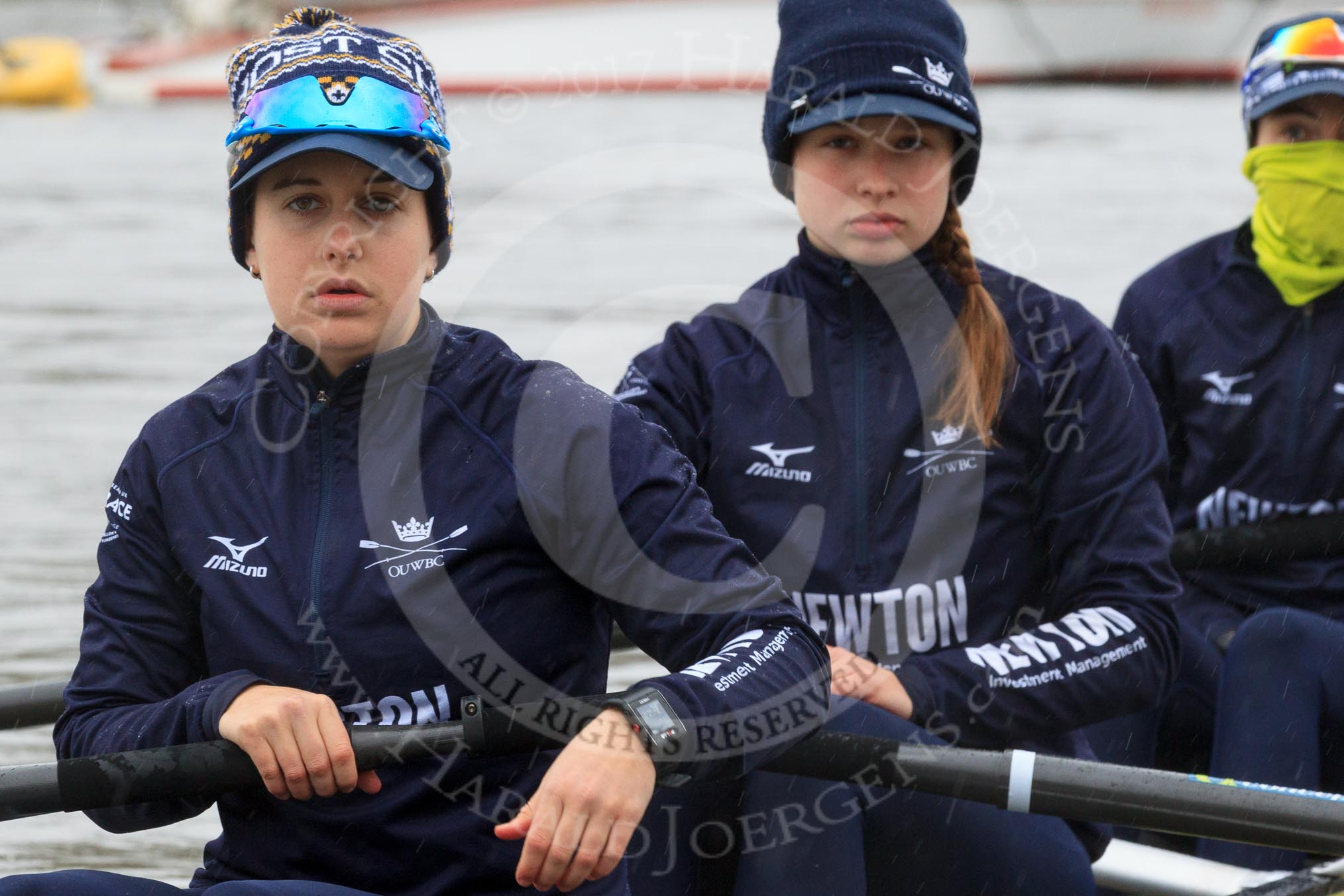 The Women's Boat Race season 2018 - fixture OUWBC vs. Molesey BC: OUWBC getting the boat ready on a cold and rainy day, here 4 seat "Ghost Ship" Alice Roberts, 3 Juliette Perry, 2 Katherine Erickson.
River Thames between Putney Bridge and Mortlake,
London SW15,

United Kingdom,
on 04 March 2018 at 13:05, image #8