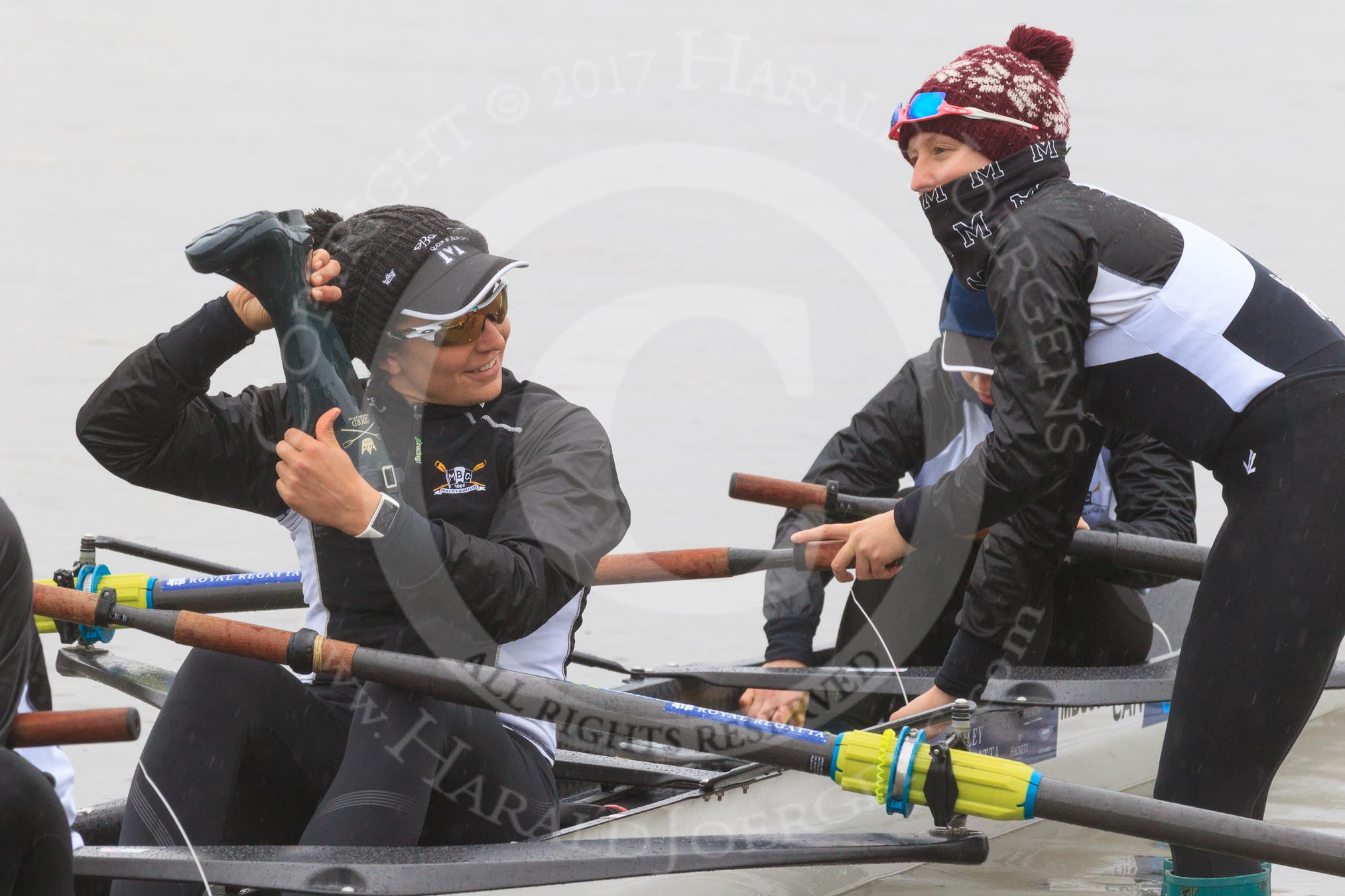 The Women's Boat Race season 2018 - fixture OUWBC vs. Molesey BC: Molesey's 3 seat Gabby Rodriguez about to throw her wellies, 2 seat Lucy Primmer, and bow Emma Boyns.
River Thames between Putney Bridge and Mortlake,
London SW15,

United Kingdom,
on 04 March 2018 at 13:09, image #17