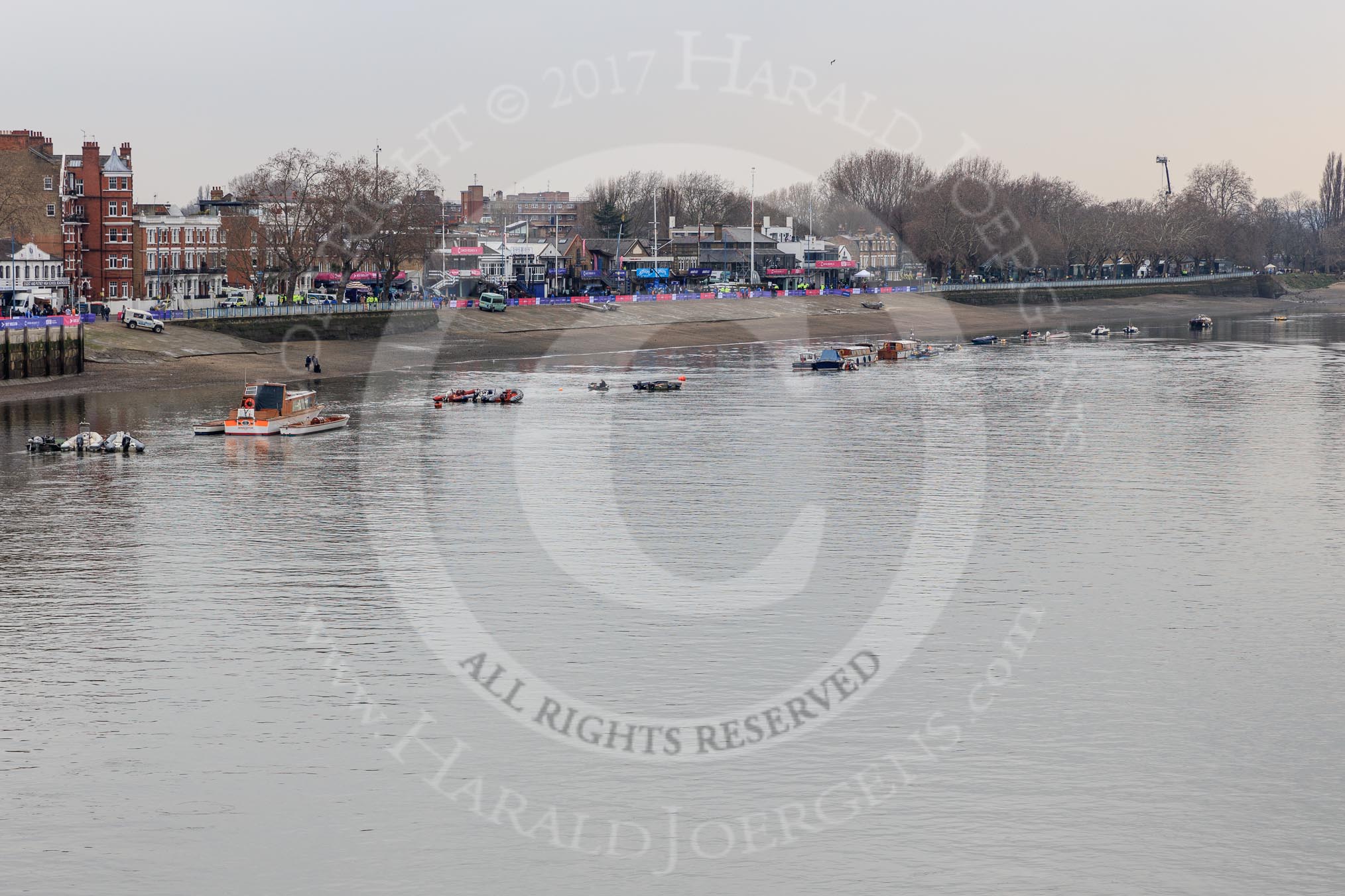 The Cancer Research UK Women's Boat Race 2018: The Putney boat houses seen from Putney Bridge, hours before the race.
River Thames between Putney Bridge and Mortlake,
London SW15,

United Kingdom,
on 24 March 2018 at 13:12, image #6