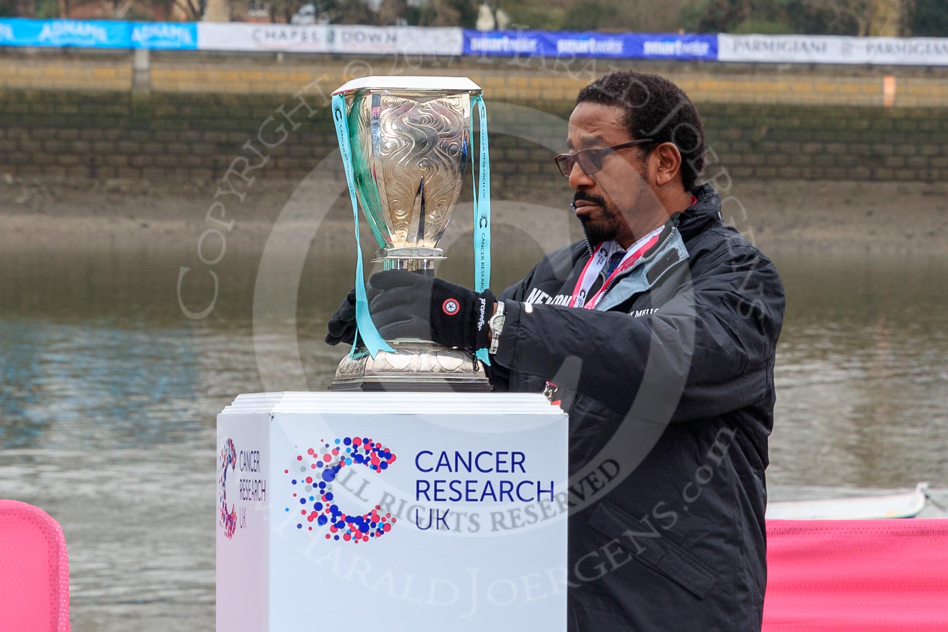 The Cancer Research UK Women's Boat Race 2018: The Women's Boat Race trophy is carefully positioned before the toss.
River Thames between Putney Bridge and Mortlake,
London SW15,

United Kingdom,
on 24 March 2018 at 14:29, image #29
