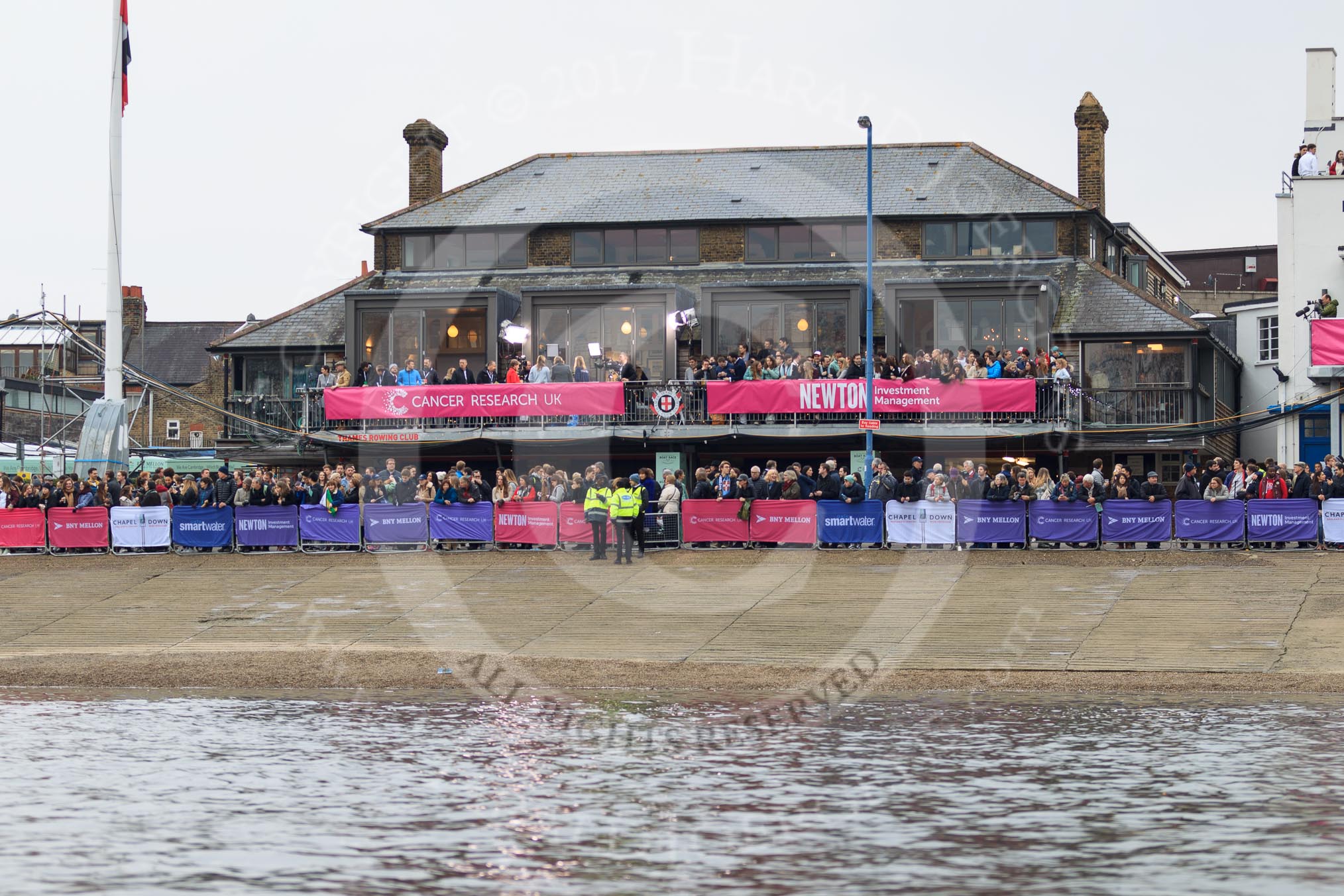 The Cancer Research UK Women's Boat Race 2018: The Thames RC boathouse, used as press office on race day. with a BBC crew and presenter Clare Balding on the balcony before the race.
River Thames between Putney Bridge and Mortlake,
London SW15,

United Kingdom,
on 24 March 2018 at 16:09, image #141